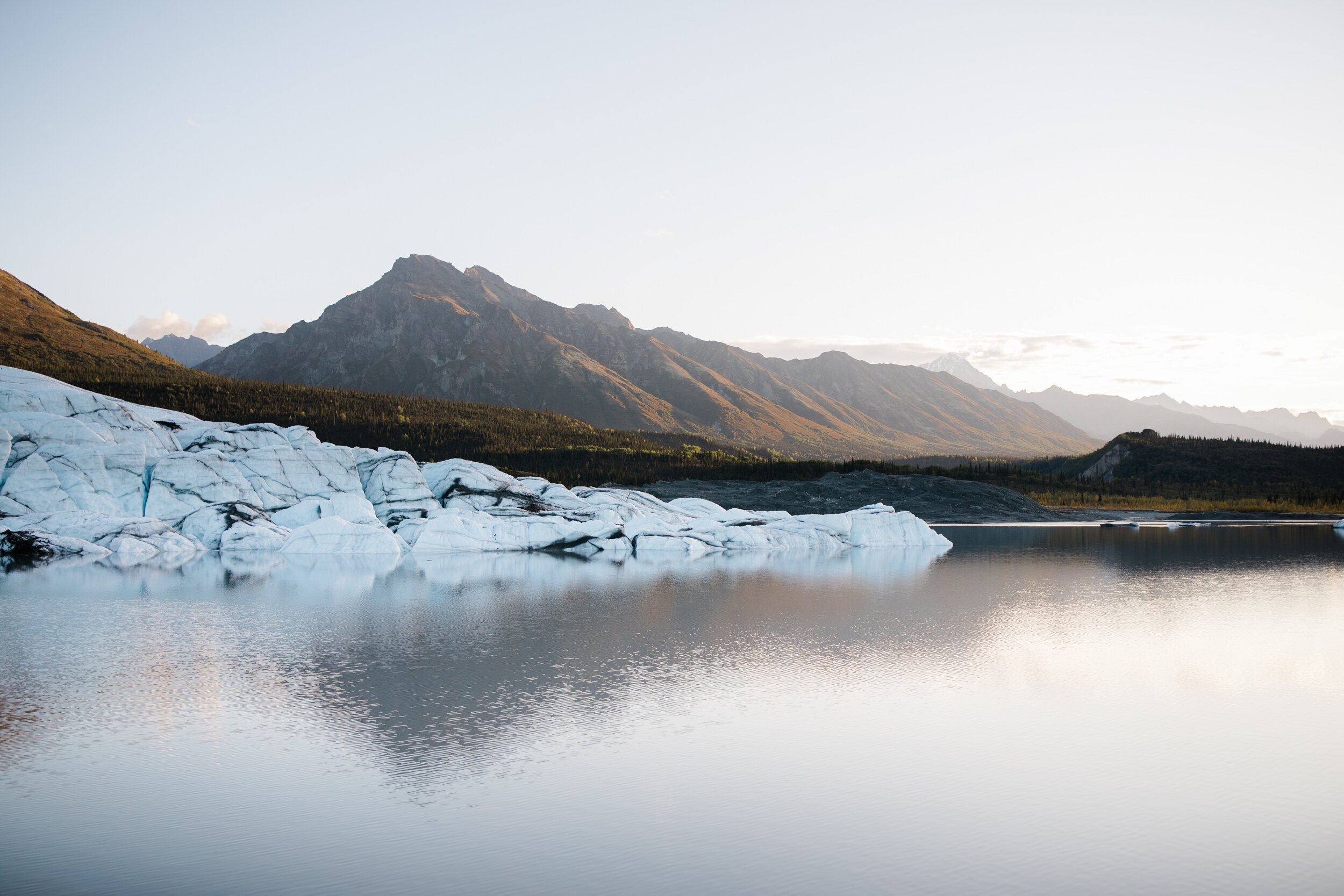 Glacier Hiking Elopement in Alaska | Day-After Wedding Session | Blush Wedding Dress | Dark Green Groom Suit | The Hearnes Adventure Photography