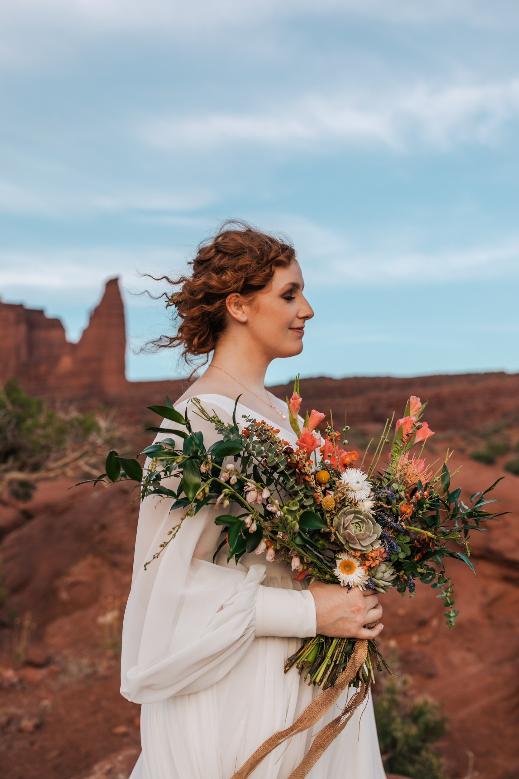 Moab, Utah Adventure Elopement Redhead Bride with Tropical Colorful Flowers | The Hearnes Adventure Photography