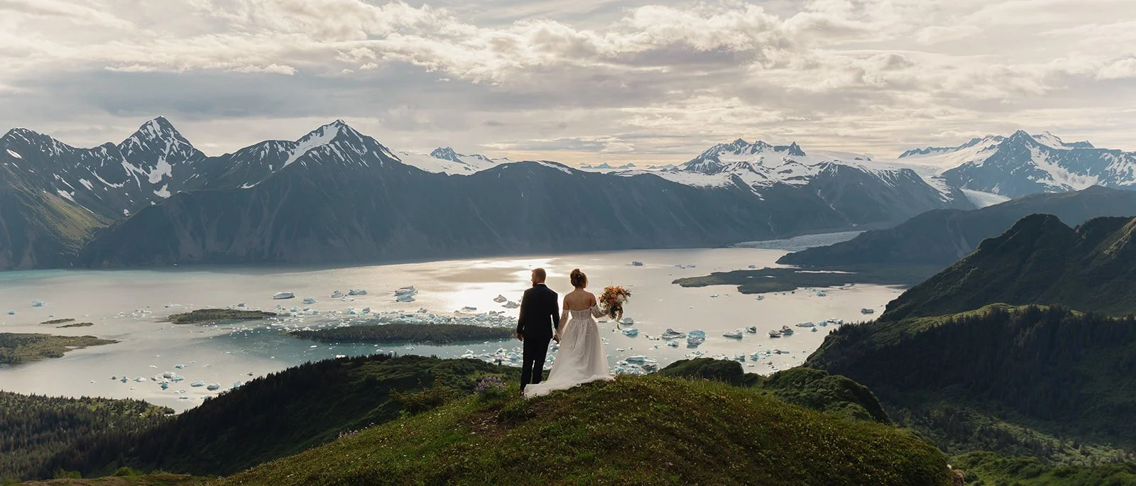 Alaska micro wedding elopement with a helicopter flying to glaciers and mountain tops with The Hearnes Photography