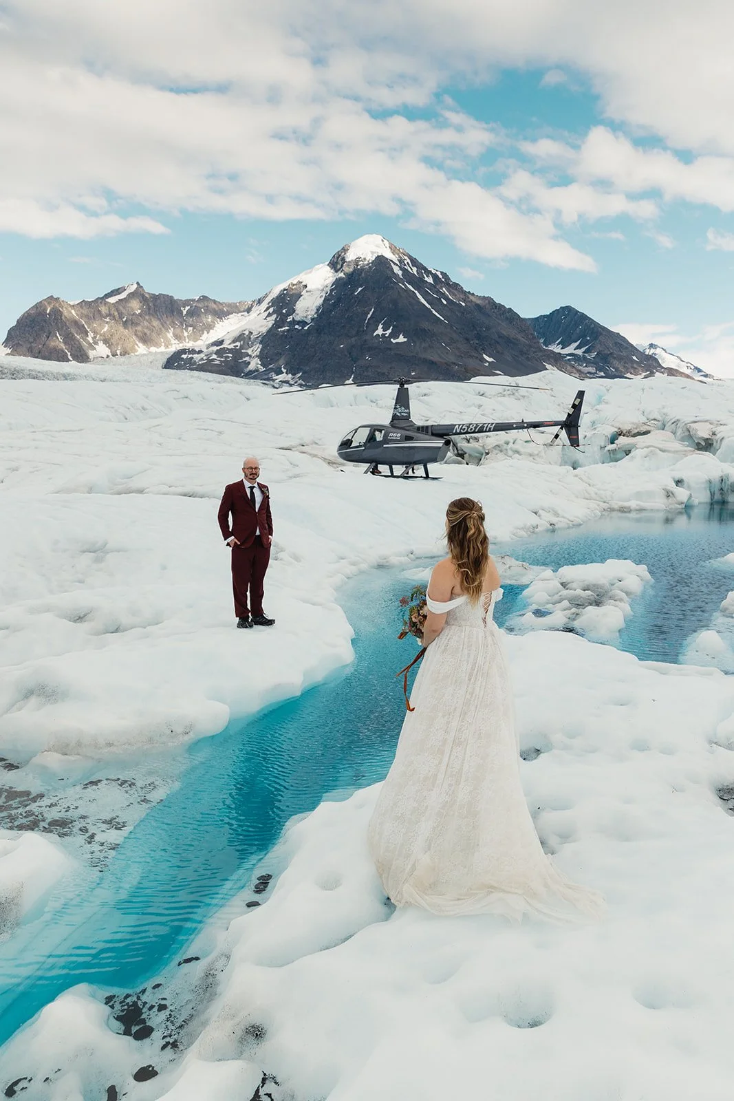 Alaska micro wedding elopement with a helicopter flying to glaciers and mountain tops with The Hearnes Photography
