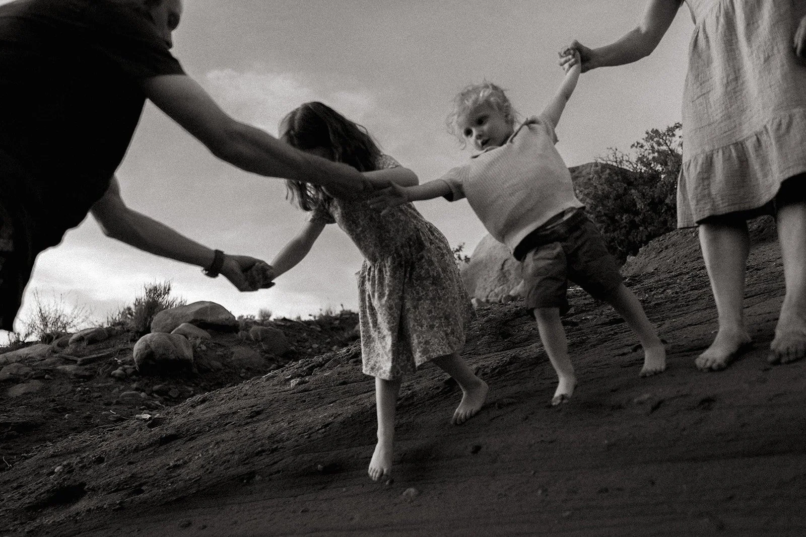 Authentic candid family photos in Moab, Utah desert with Abbi Hearne