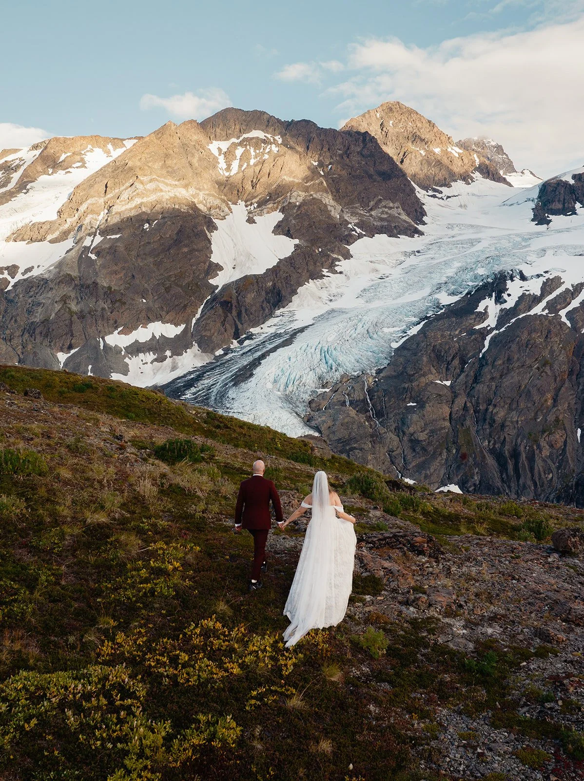 Alaska micro wedding elopement with a helicopter flying to glaciers and mountain tops with The Hearnes Photography