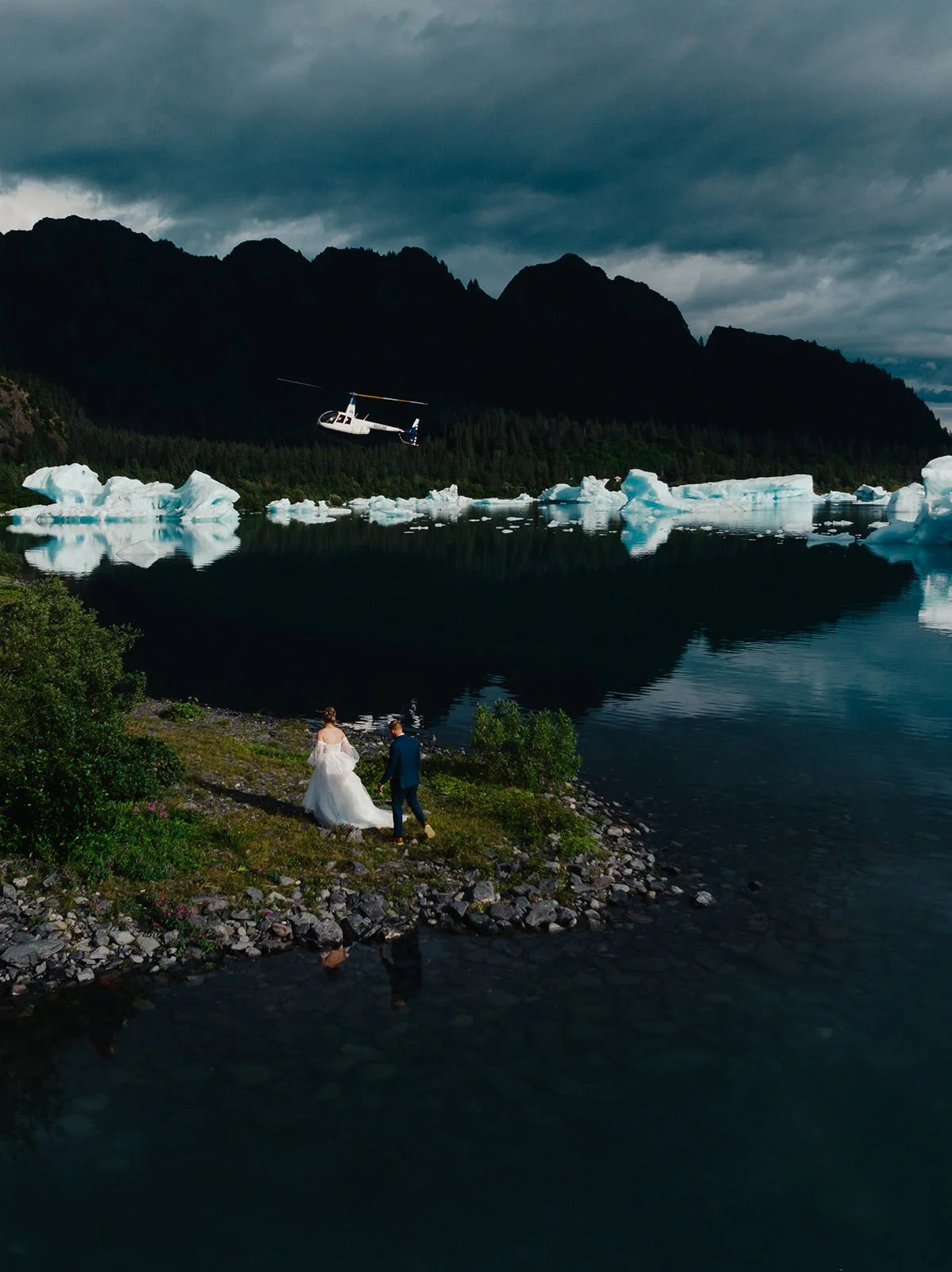 Alaska micro wedding elopement with a helicopter flying to glaciers and mountain tops with The Hearnes Photography