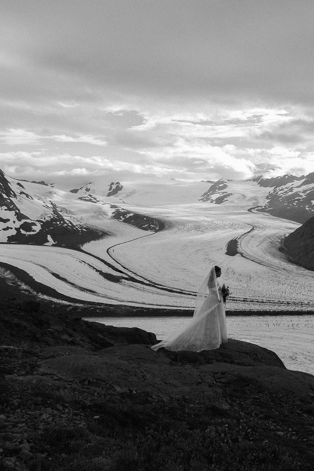 Alaska micro wedding elopement with a helicopter flying to glaciers and mountain tops with The Hearnes Photography