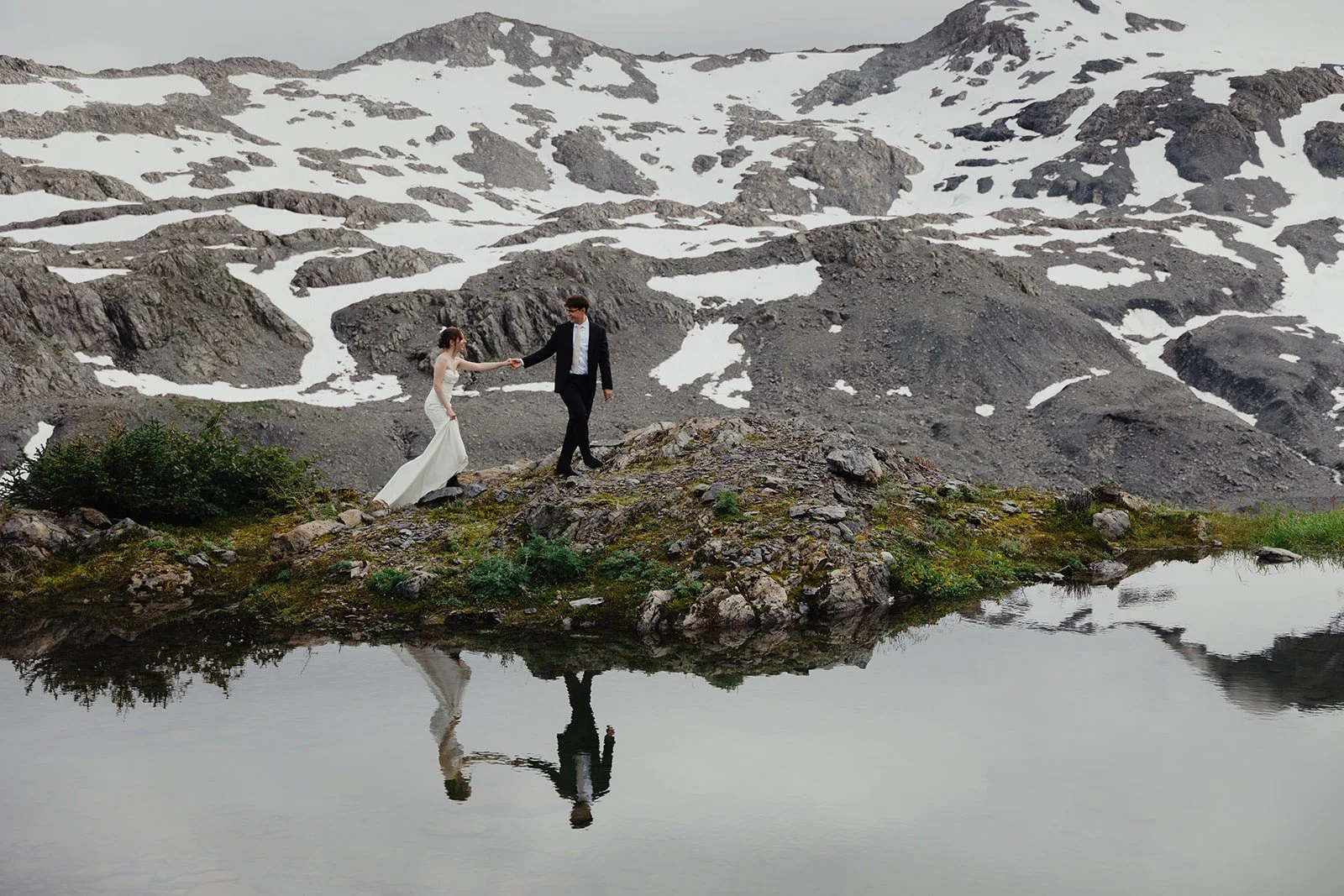 Alaska micro wedding elopement with a helicopter flying to glaciers and mountain tops with The Hearnes Photography