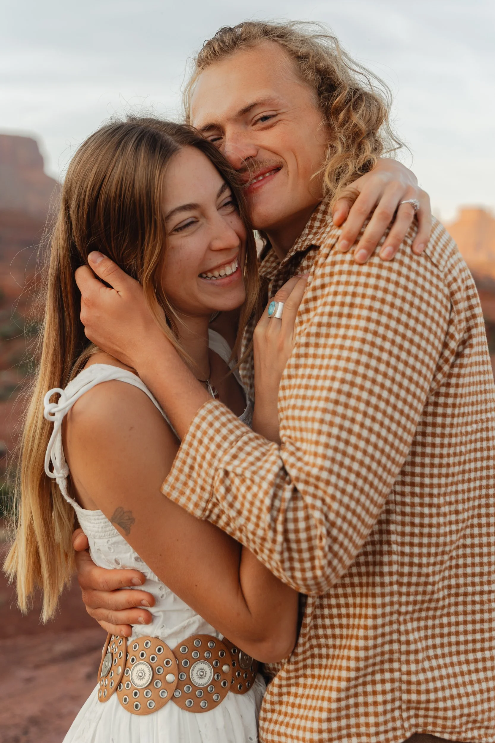 Rachel Harris @sunnrayy + Tanner Price @tanner.price_ engaged in Moab, Utah | sunrise surprise proposal with The Hearnes