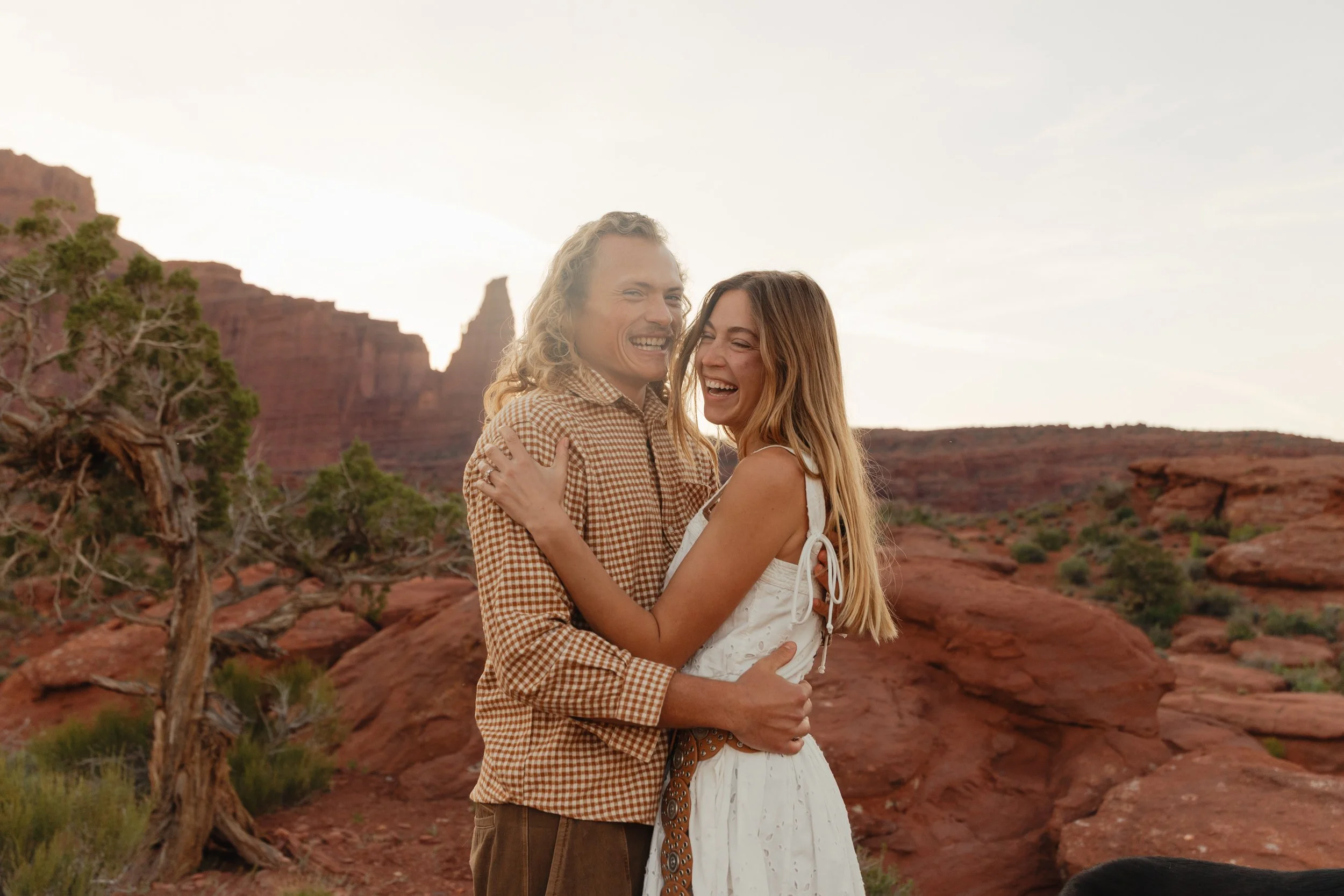 Rachel Harris @sunnrayy + Tanner Price @tanner.price_ engaged in Moab, Utah | sunrise surprise proposal with The Hearnes