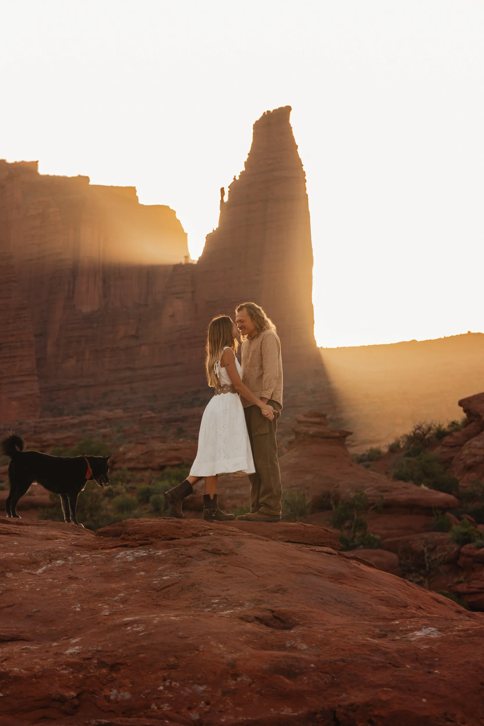 Rachel Harris @sunnrayy + Tanner Price @tanner.price_ engaged in Moab, Utah | sunrise surprise proposal with The Hearnes