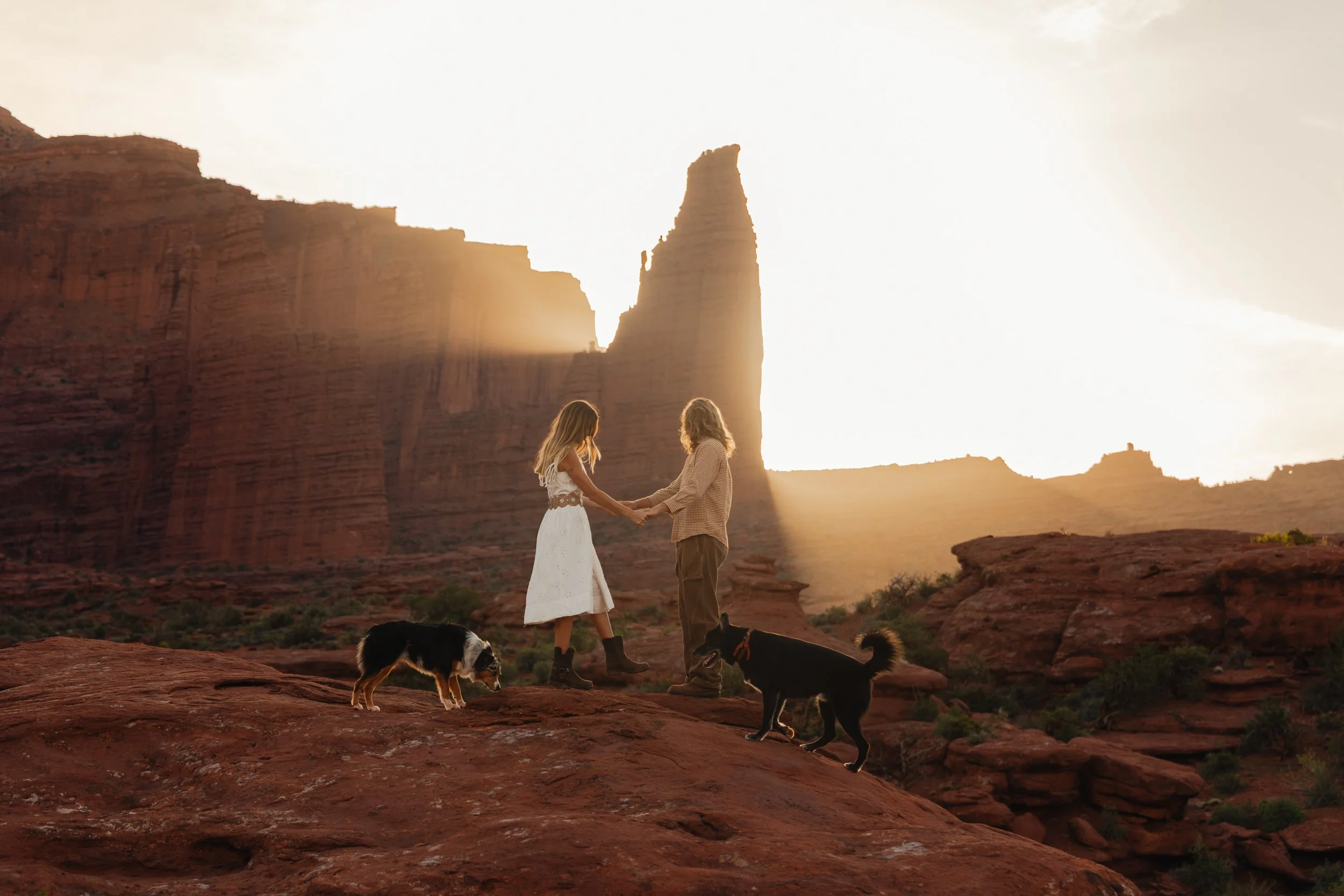 Rachel Harris @sunnrayy + Tanner Price @tanner.price_ engaged in Moab, Utah | sunrise surprise proposal with The Hearnes