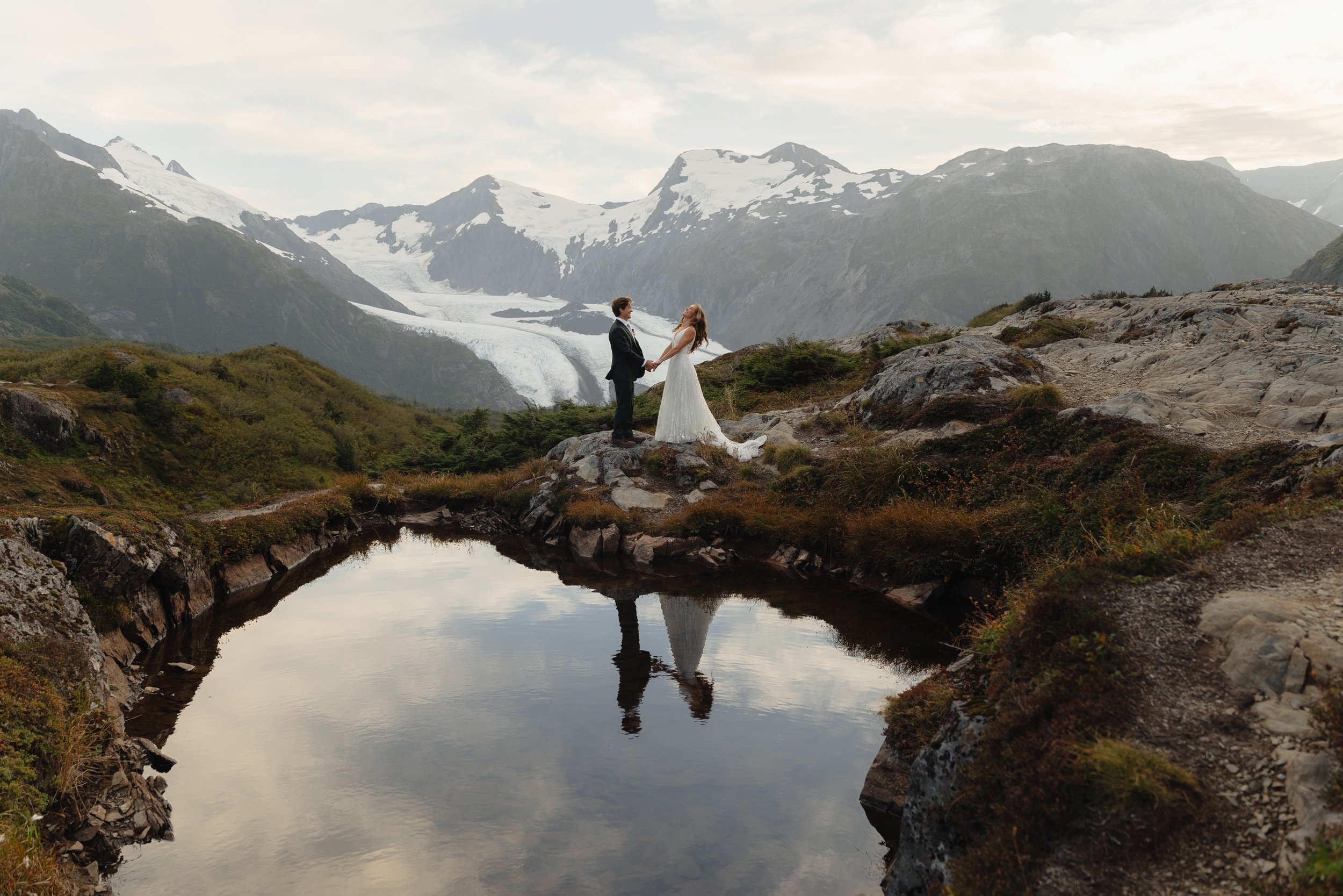 Hiking mountain top elopement in Alaska surrounded by glaciers | the hearnes adventure photography
