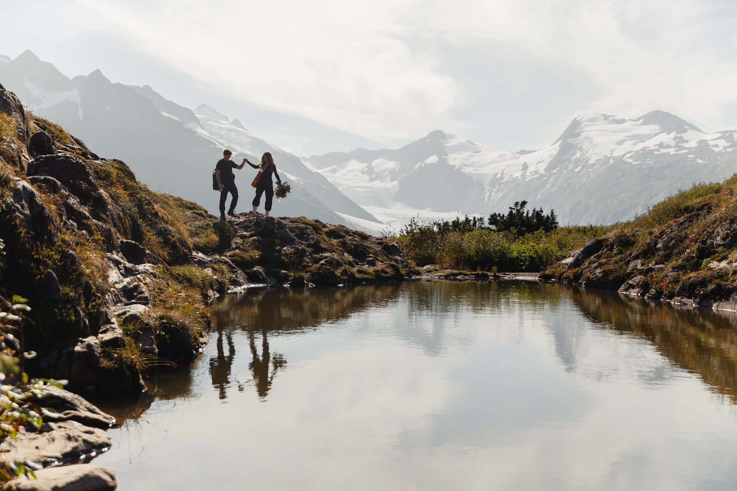 Hiking mountain top elopement in Alaska surrounded by glaciers | the hearnes adventure photography