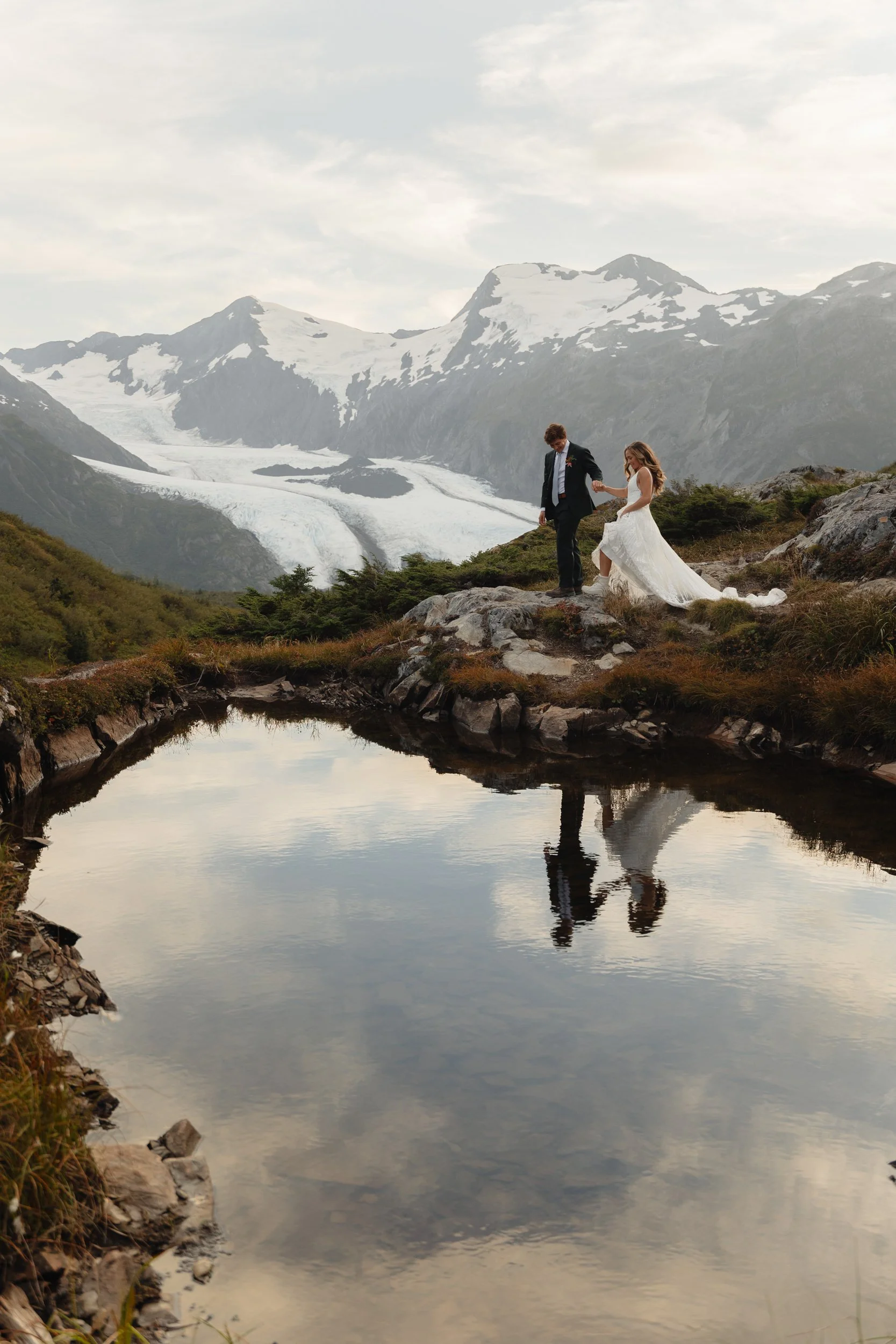 Hiking mountain top elopement in Alaska surrounded by glaciers | the hearnes adventure photography