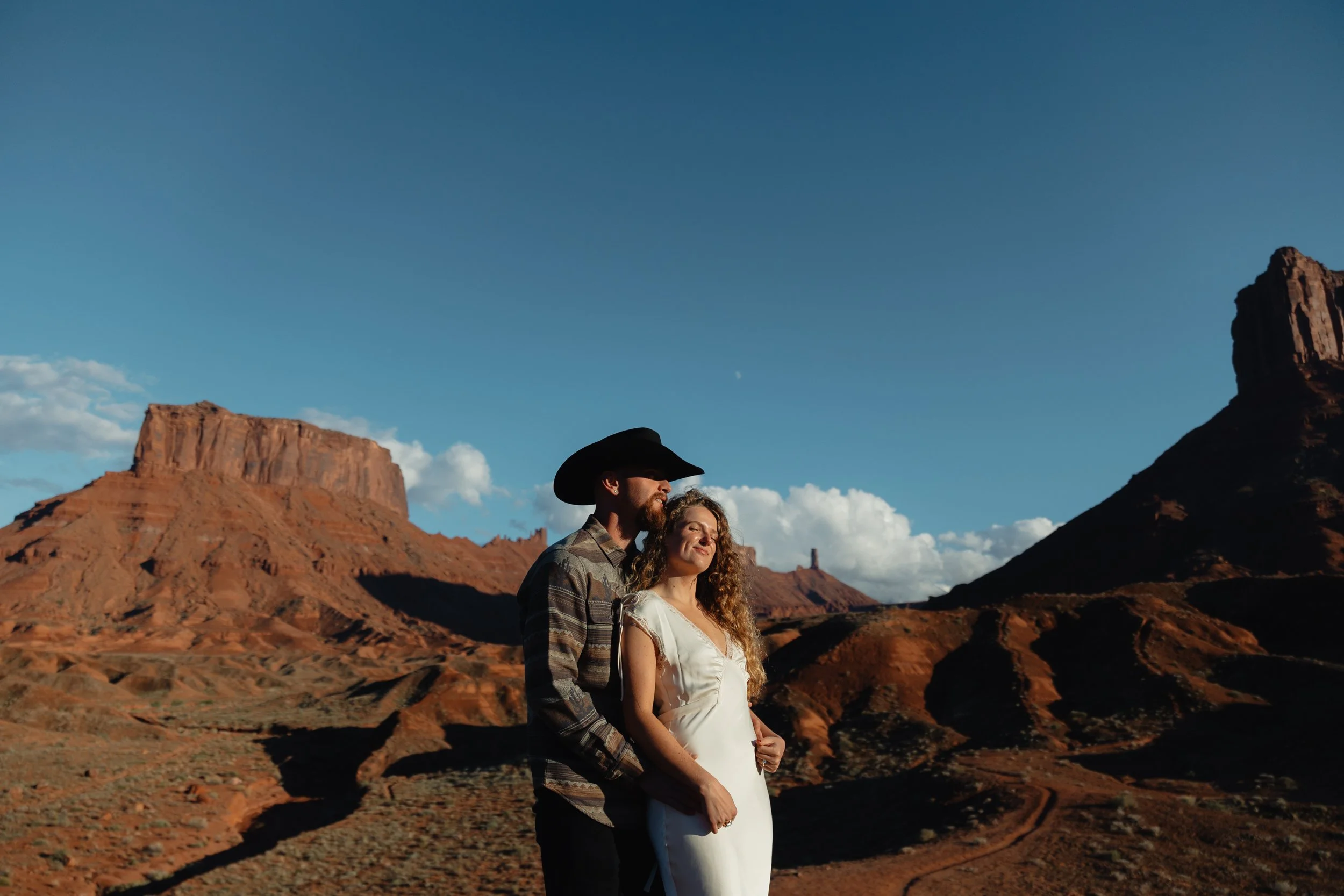 western Engagement portrait session in Moab Utah with a dog