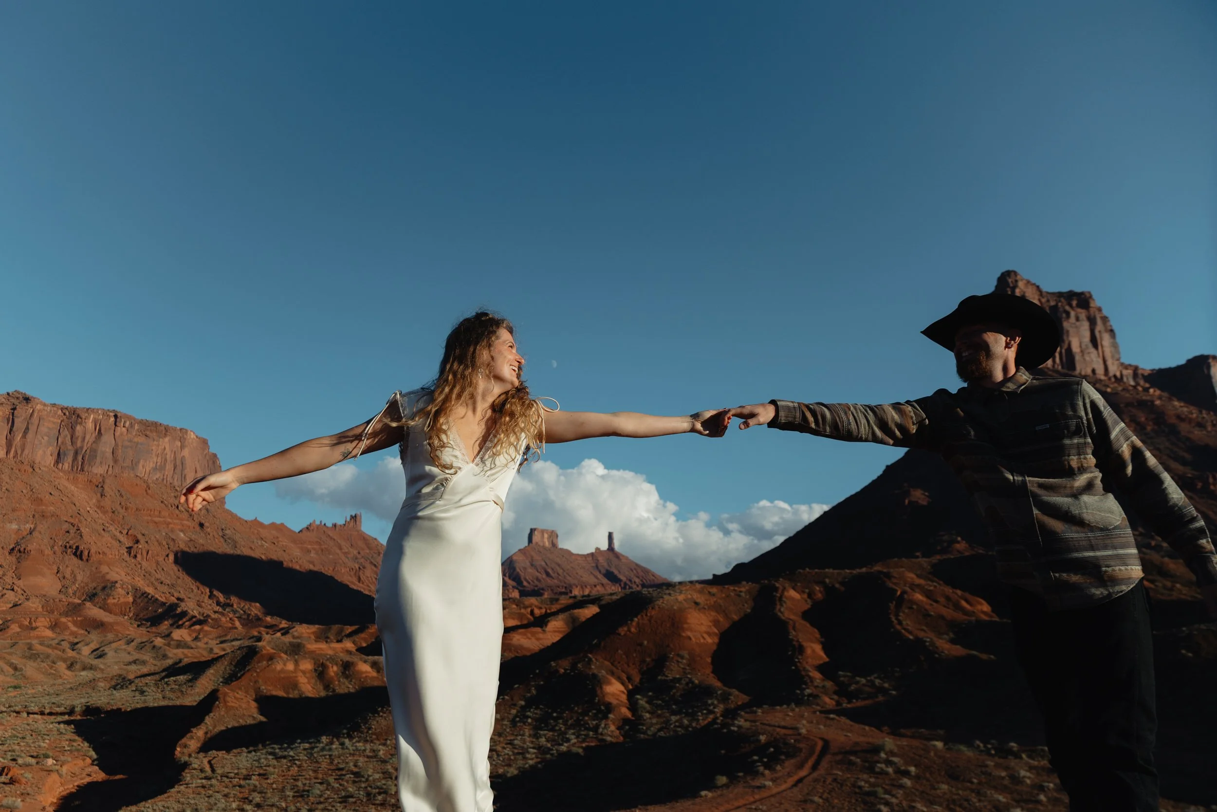western Engagement portrait session in Moab Utah with a dog
