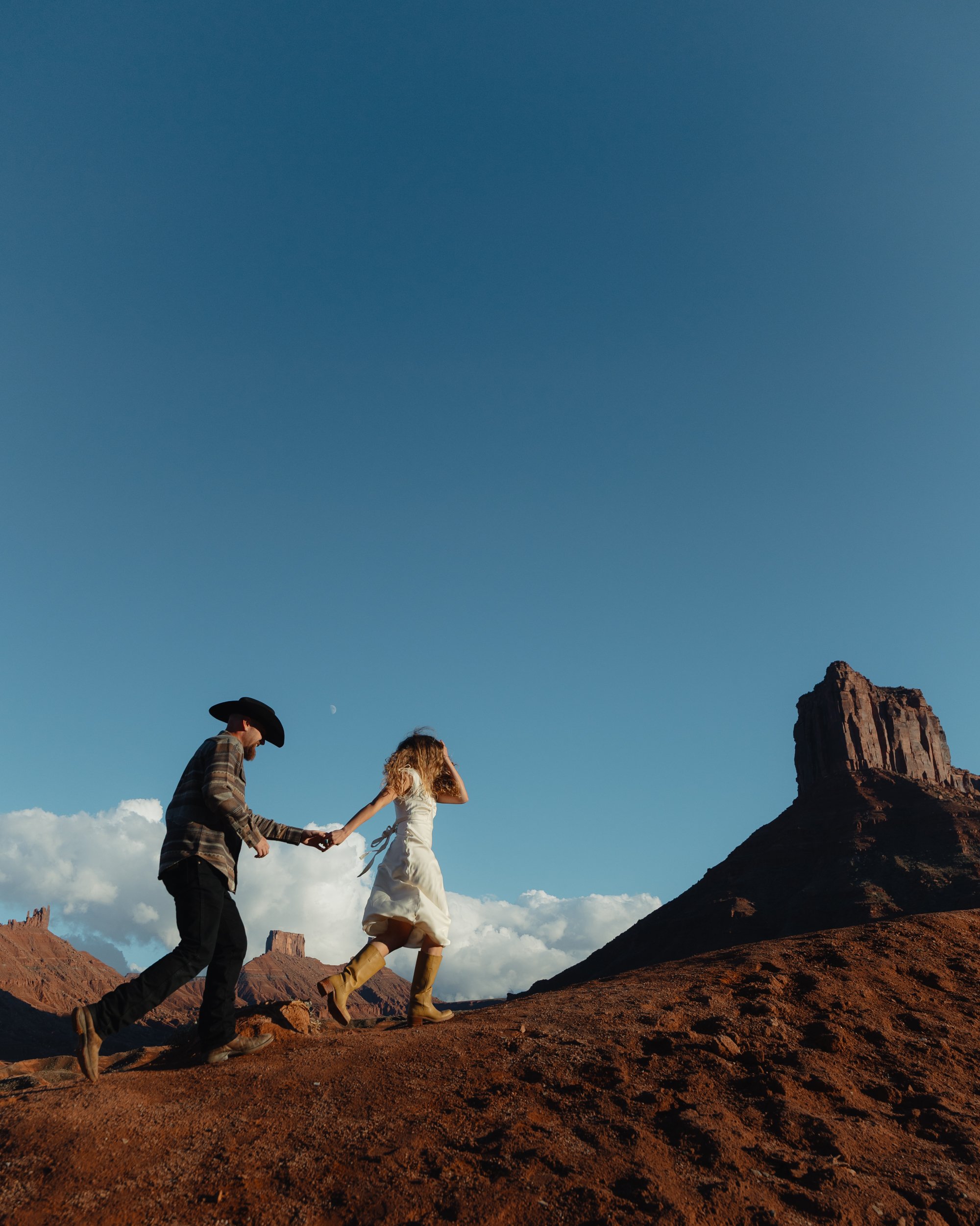western Engagement portrait session in Moab Utah with a dog