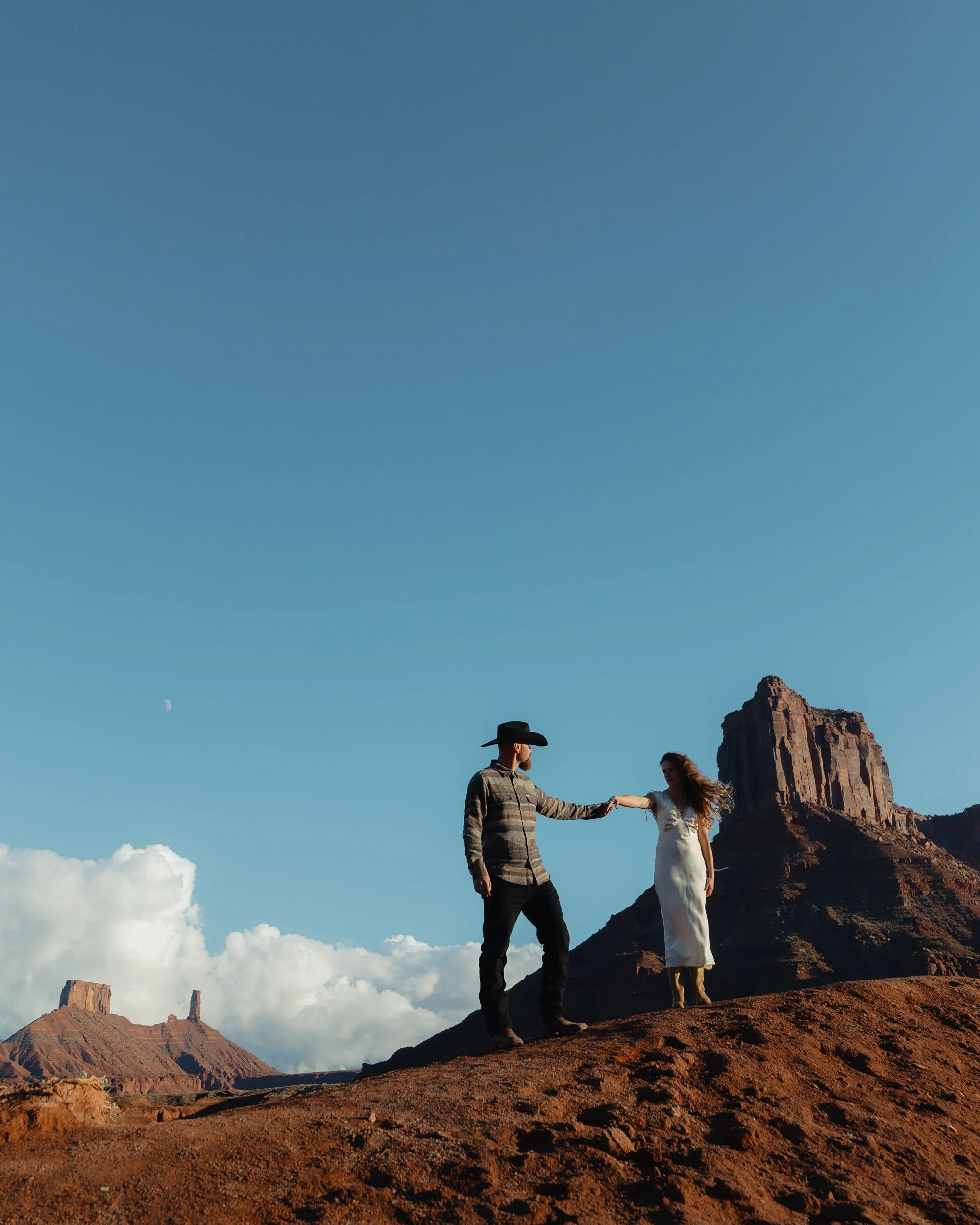 western Engagement portrait session in Moab Utah with a dog