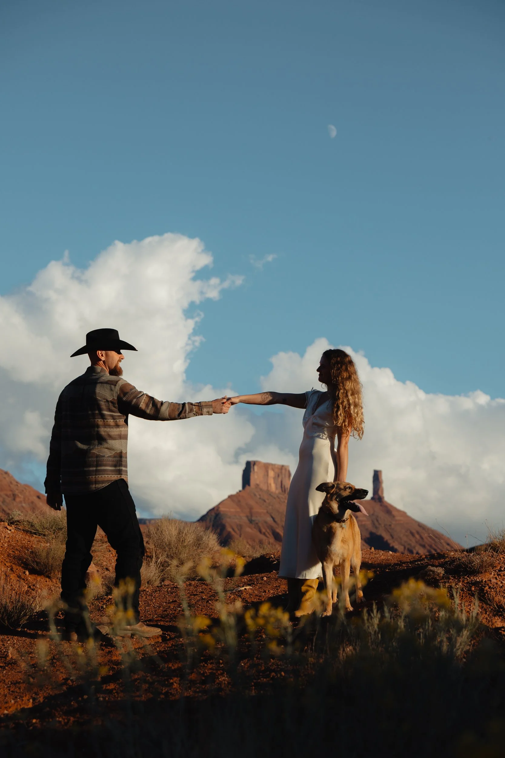western Engagement portrait session in Moab Utah with a dog