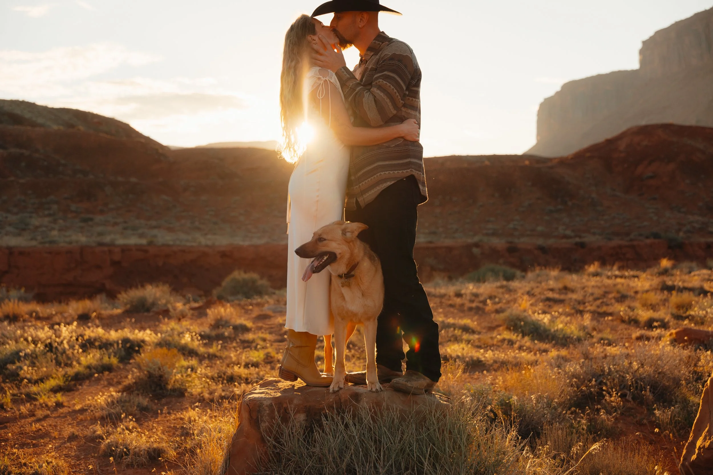 western Engagement portrait session in Moab Utah with a dog