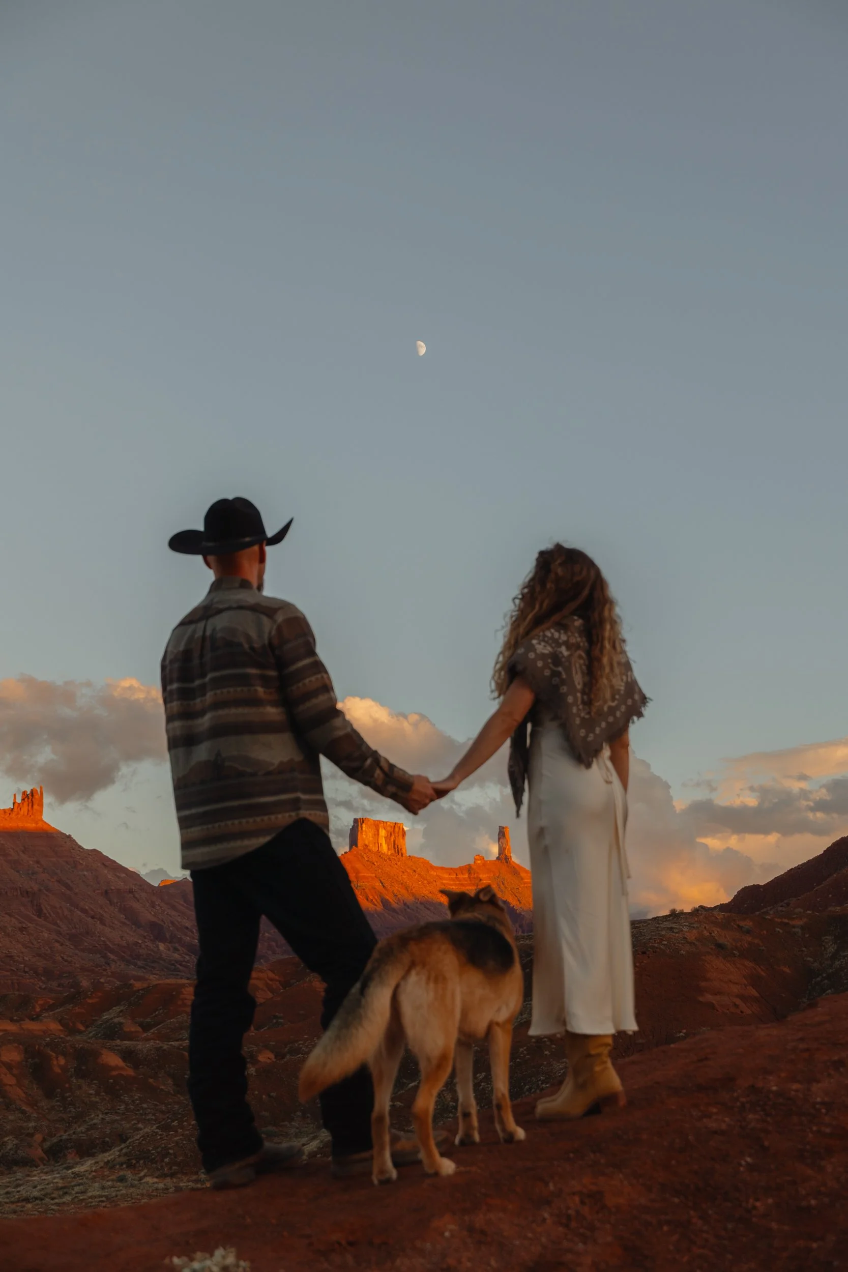 western Engagement portrait session in Moab Utah with a dog