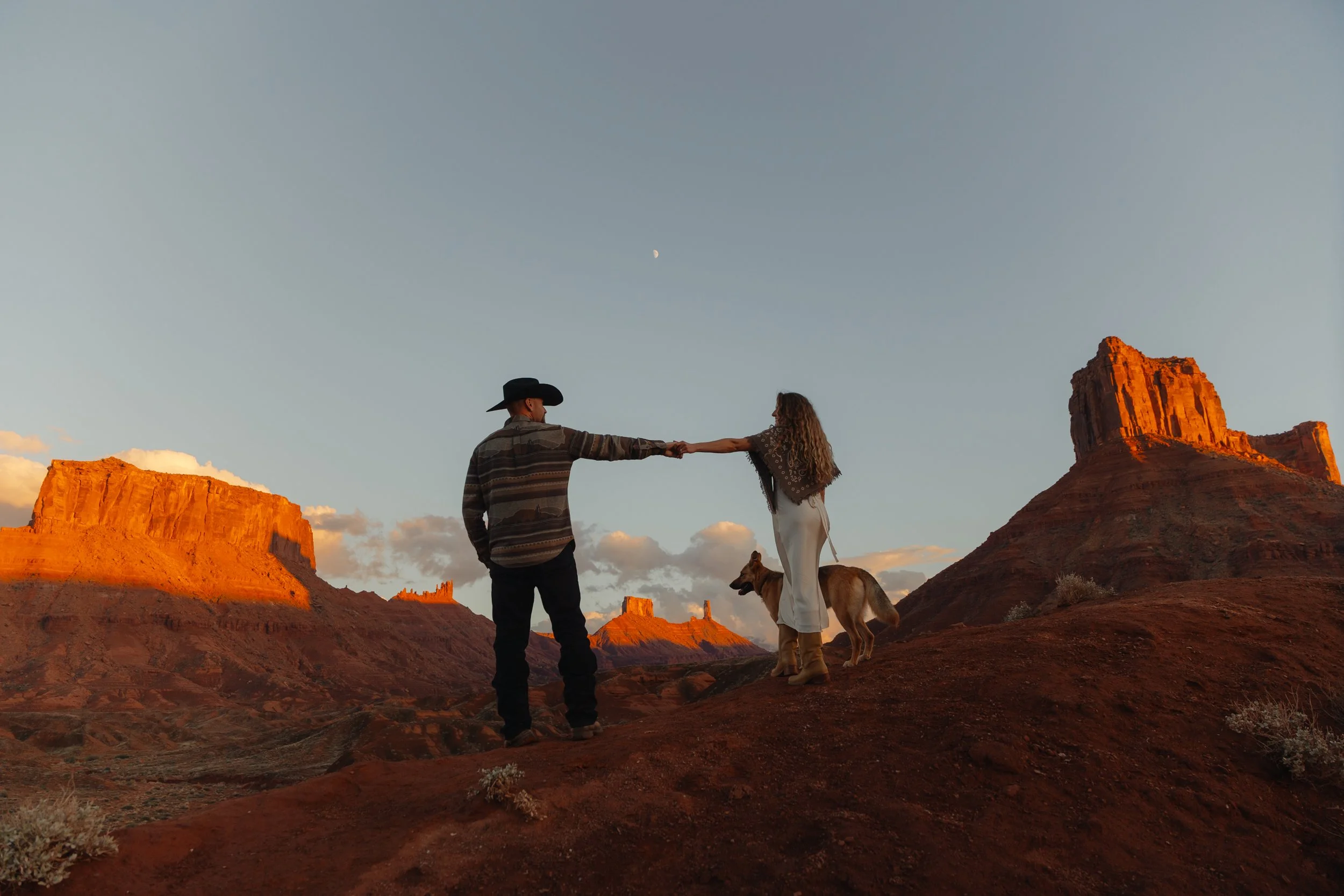 western Engagement portrait session in Moab Utah with a dog