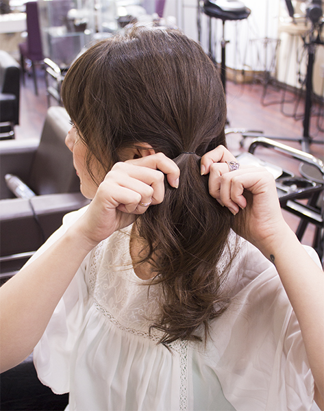 2) Tie your hair into a pony tail behind your ear. Use small hair elastic to hold.