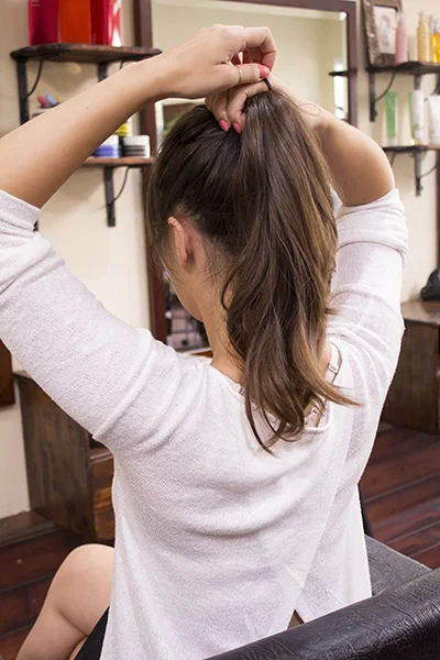 1. Tie your hair into a top pony tail.