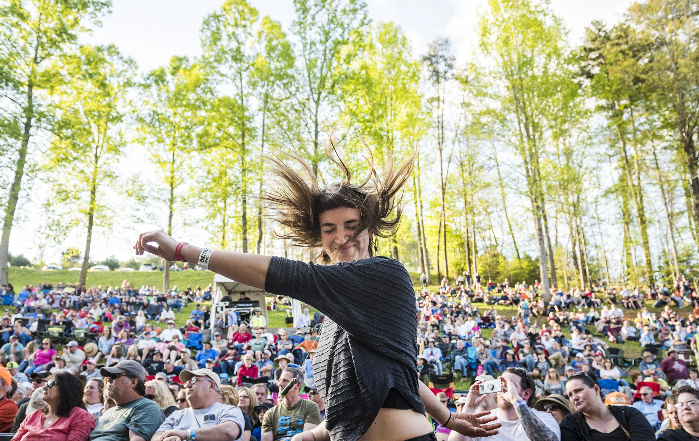  Kat Itz, of Knoxville, dances as The Devil Makes Three performs on the Hillside Stage at Merlefest on Friday, April 27, 2018 in Wilkesboro, N.C.  