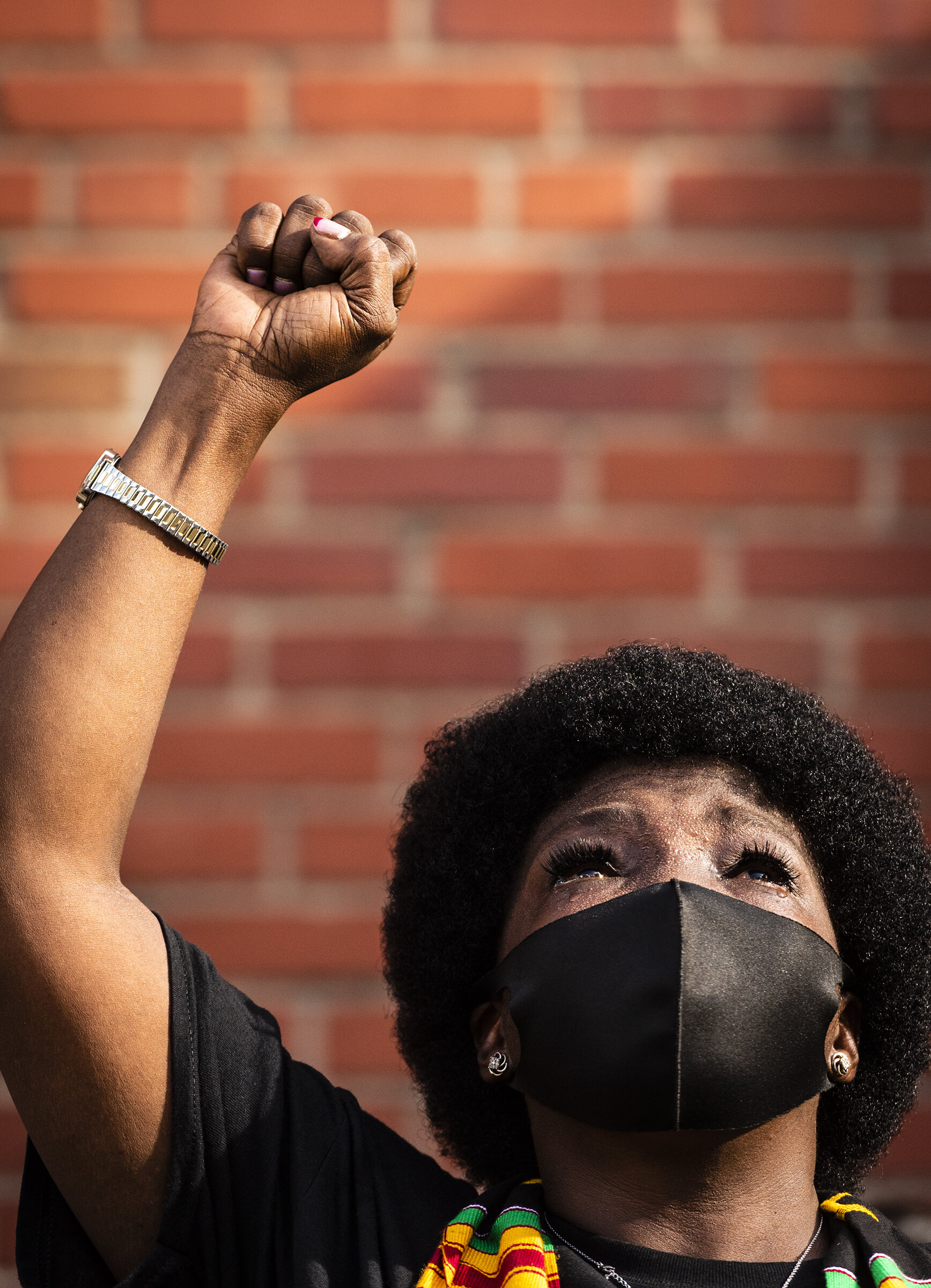  Sara Hines lifts her fist in the air during a rendition of "Lift Every Voice and Sing" during a Juneteenth rally and march against systemic racism on Friday, June 19, 2020 in Winston-Salem, N.C. 