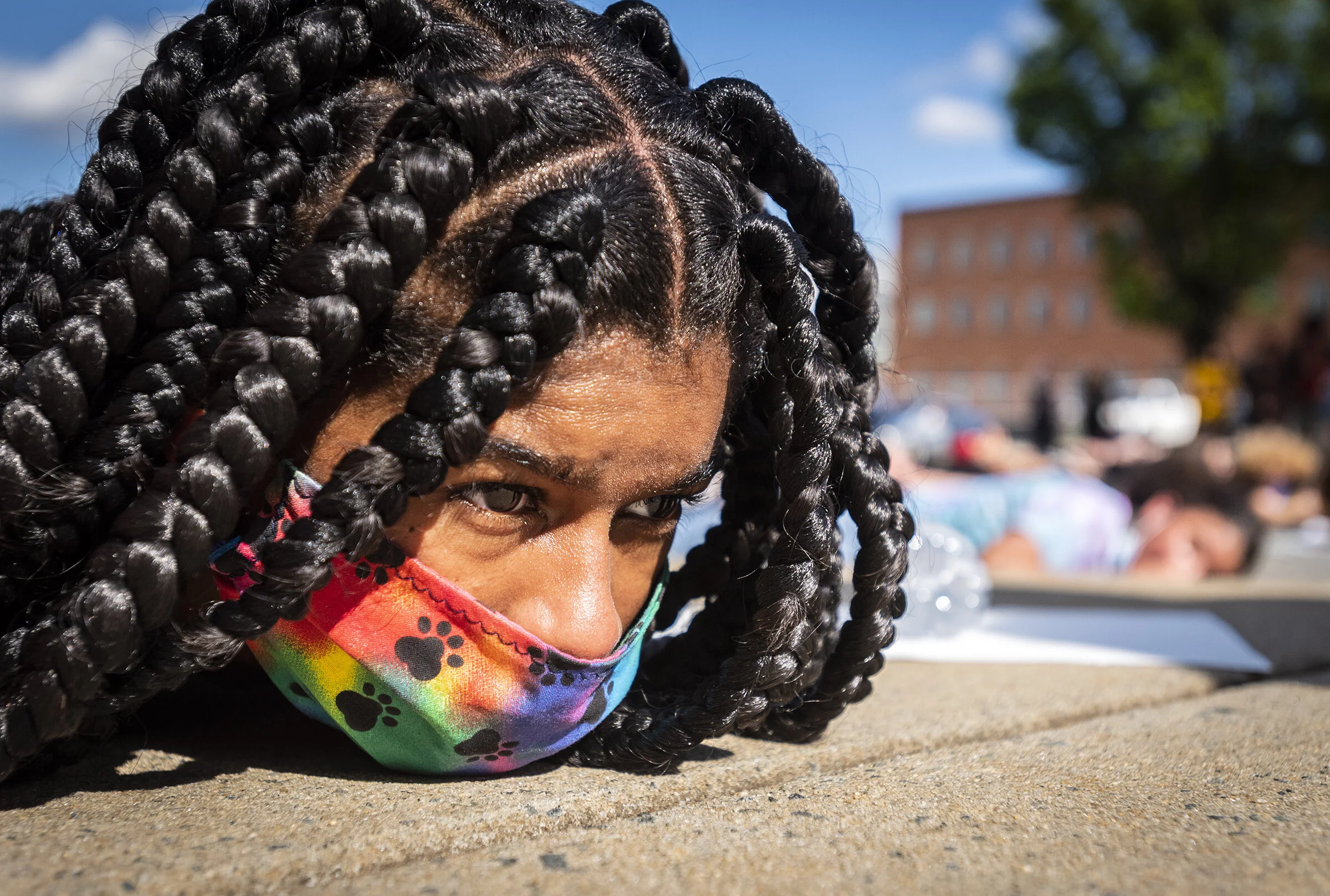  Olivia Moore, a 16-year-old who organized a Black Lives Matter rally, lies facedown on the concrete for nine minutes in remembrance of the nine minutes a Minneapolis Police officer kept George Floyd pinned with a knee on his neck on Sunday, May 31, 