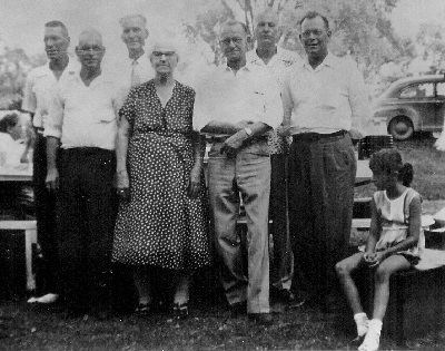 Back row, L=R: Kenneth Clay; Leon Keith; Paul Elry; Harvey Darwin Front Row, L=R: Eugene Agustus; Eva Hyde Jones; William Carl Front row, far right: Kendra Lou (Jones Kenneth’s granddaughter) 1955, Unknown location