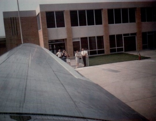 Craig leaving Mason City, Iowa, airport, 7/2/1966 Marian and Kenneth Garrett larger figures to the right of the airplane wing.
