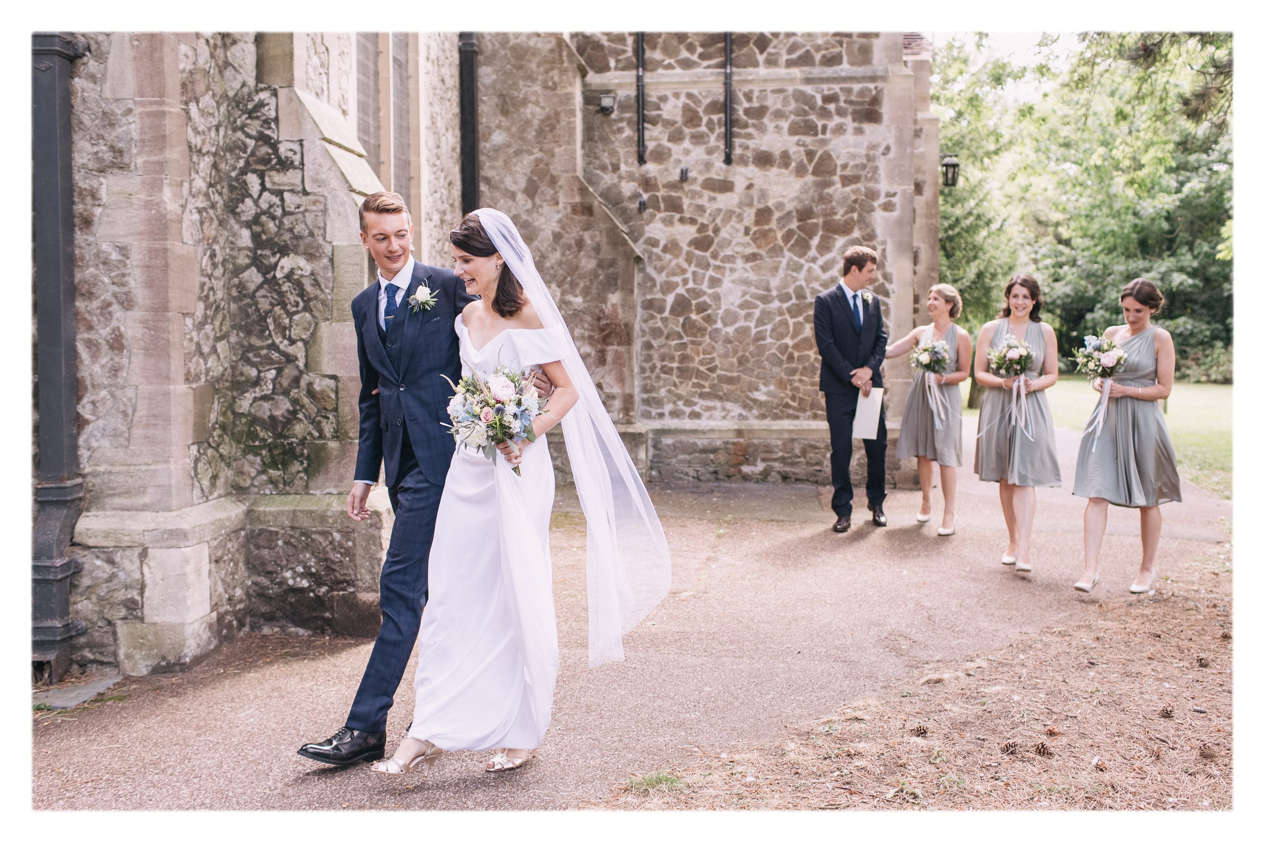 Louise wearing a Classic Veil - white tulle, custom length oval veil with raw edge finish