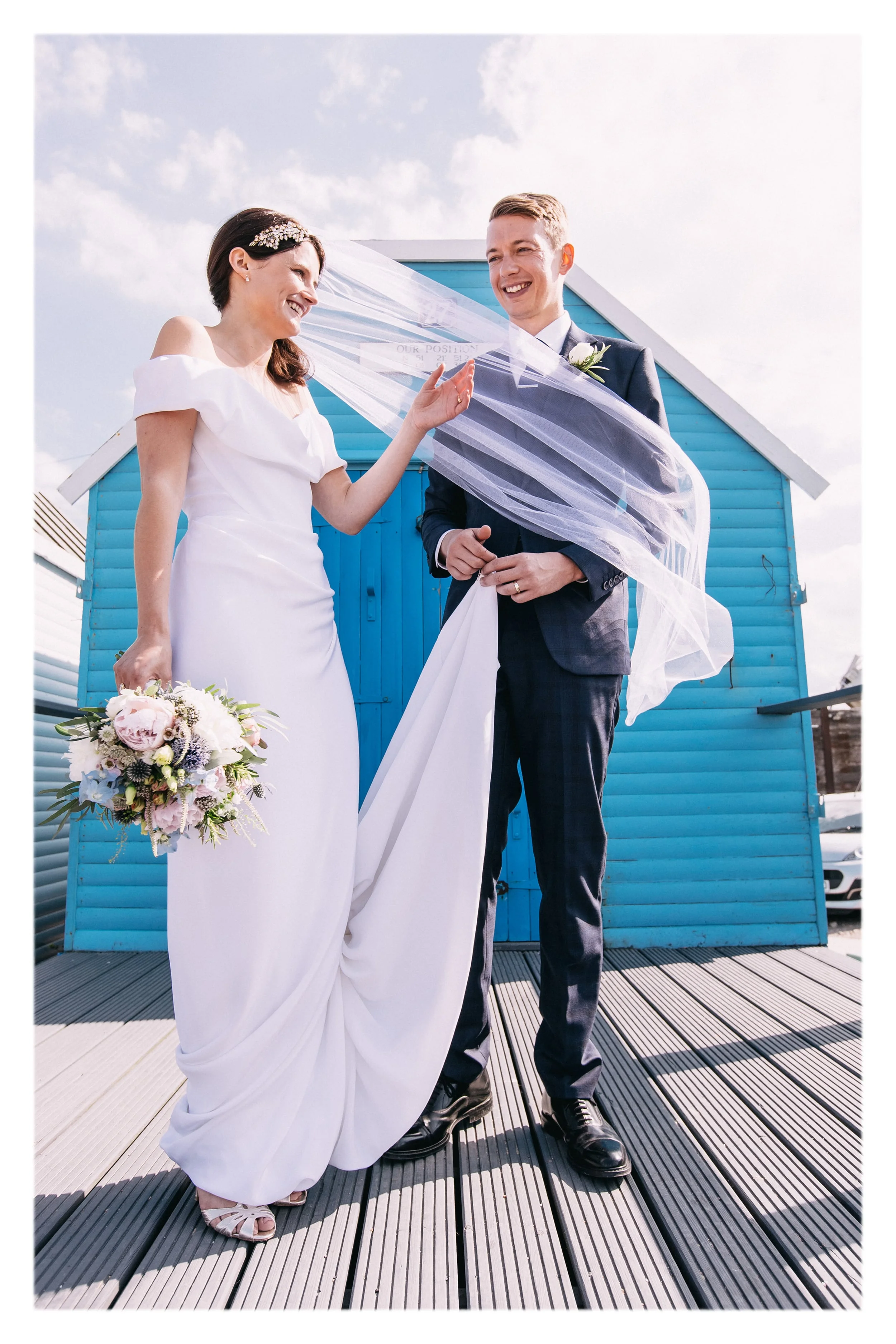Louise wearing a Classic Veil - white tulle, custom length oval veil with raw edge finish