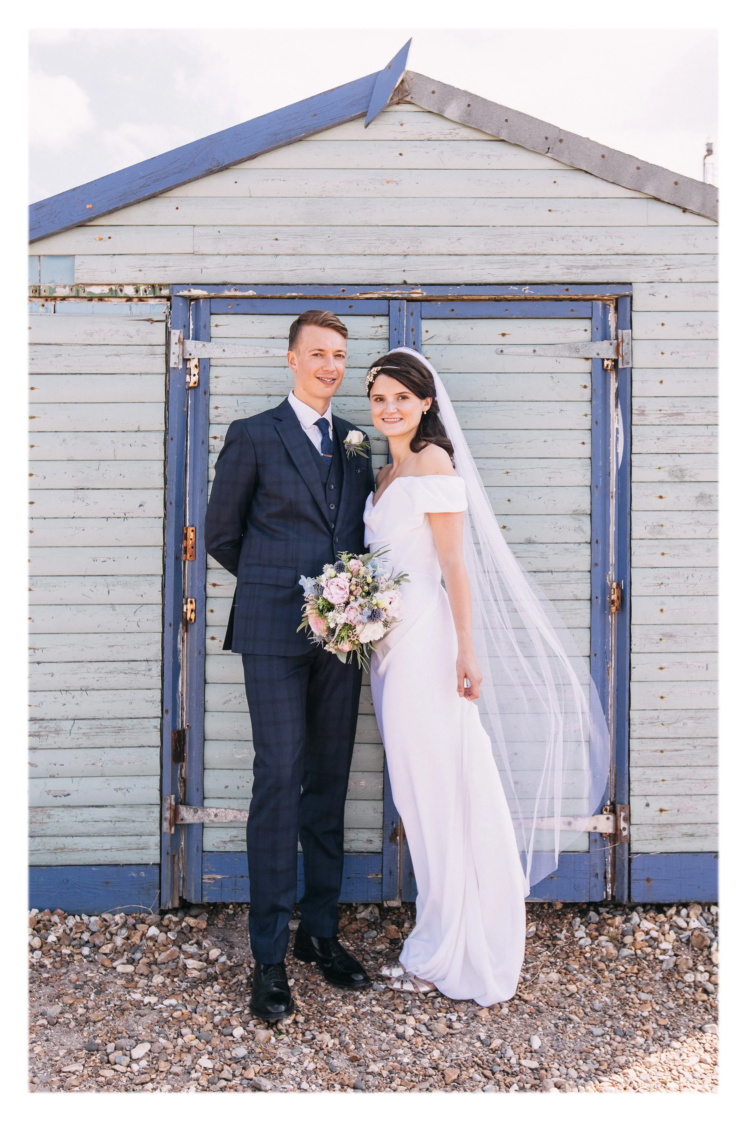 Louise wearing a Classic Veil - white tulle, custom length oval veil with raw edge finish