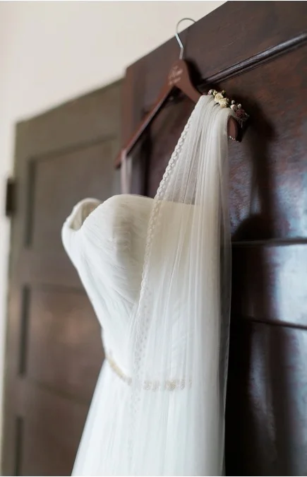 Rocco wearing a Classic Veil - Ivory finished with custom spotted lace edge and parchment flower comb