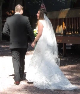 Ashley wearing a pink Yorkshire flower crown and veil with a Rexcote lace edge