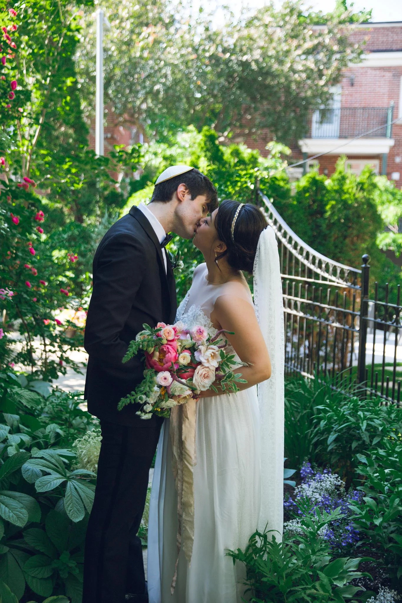 Chloe wearing the Isle of Ely veil - A full lace ivory veil with scalloped edging