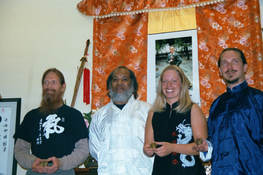 Red Morton, Warren Pretlow (their teacher), Wendy DeGraffenried, Michael DeMolina in their anchorage, alaska school, Spring 2002 at improvised medal ceremony in front of Jou Tsung Hwa altar. Tested and awarded by laoMa at first long distant testing.
