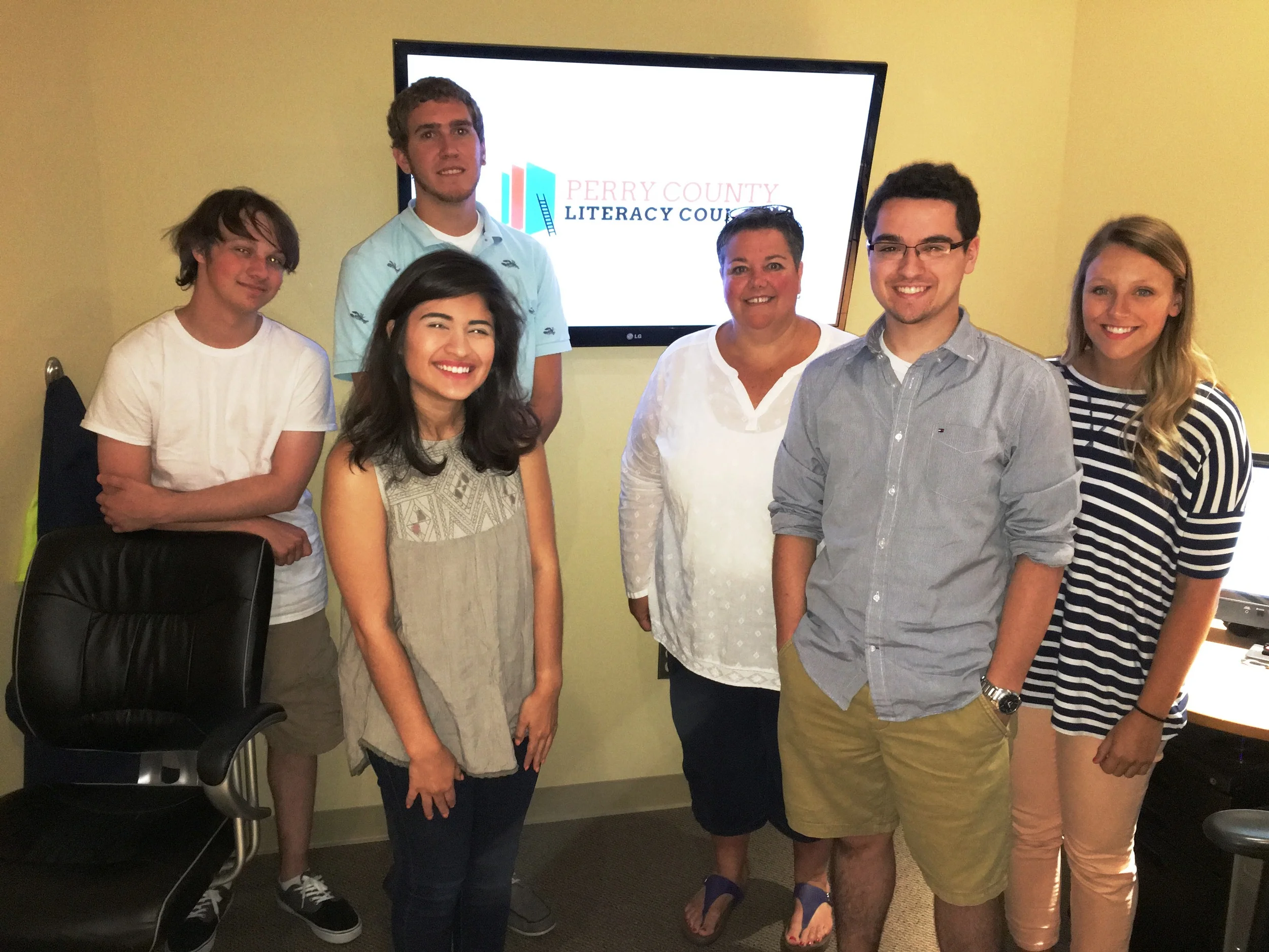 A group photo after showing the final video to Leslie Heimbaugh, Office Manager at the PCLC.