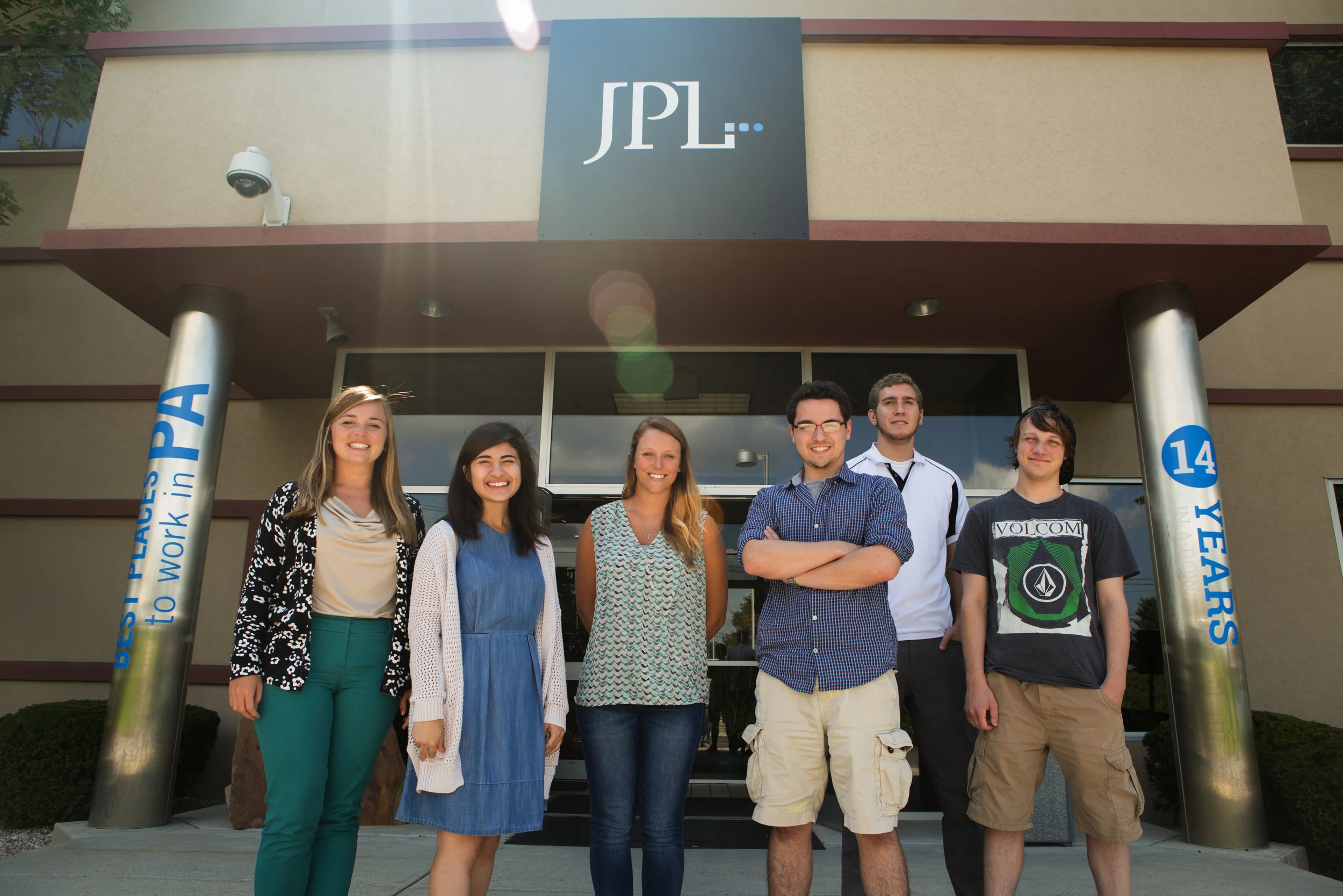 Final group shot outside the office. From left to right: Meghan Donegan, Account Management Intern; Alyssa Chavez, Art Direction Intern; Emily Strange, Production Intern; John MacDonald Jr, Production Intern; Evan Weber, Digital Marketing Intern; an…
