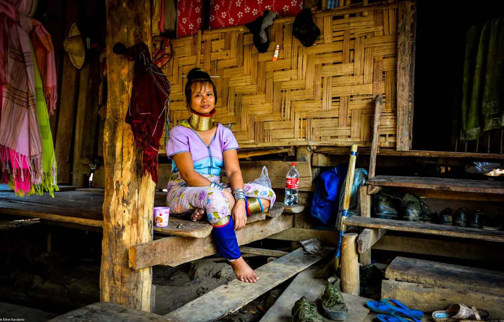 Woman sitting in front her house
