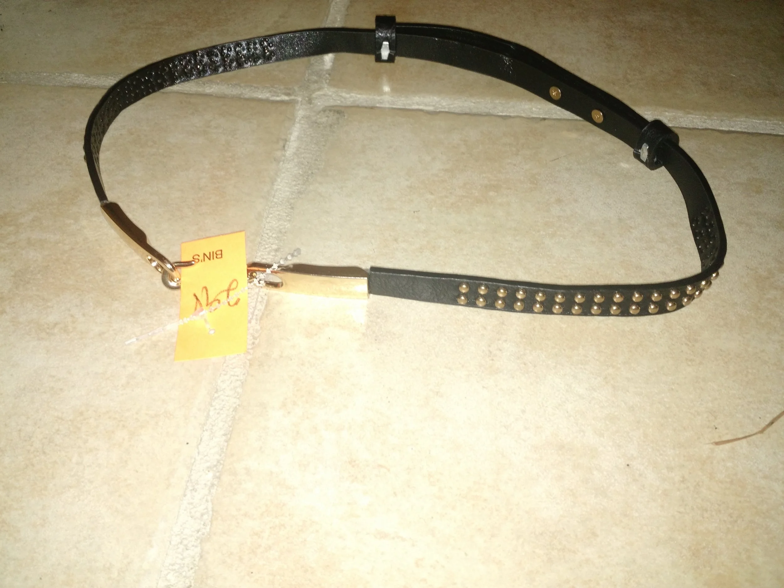 This belt is resized by pulling on the 2 loops. Perfect for one of my oversized sweaters