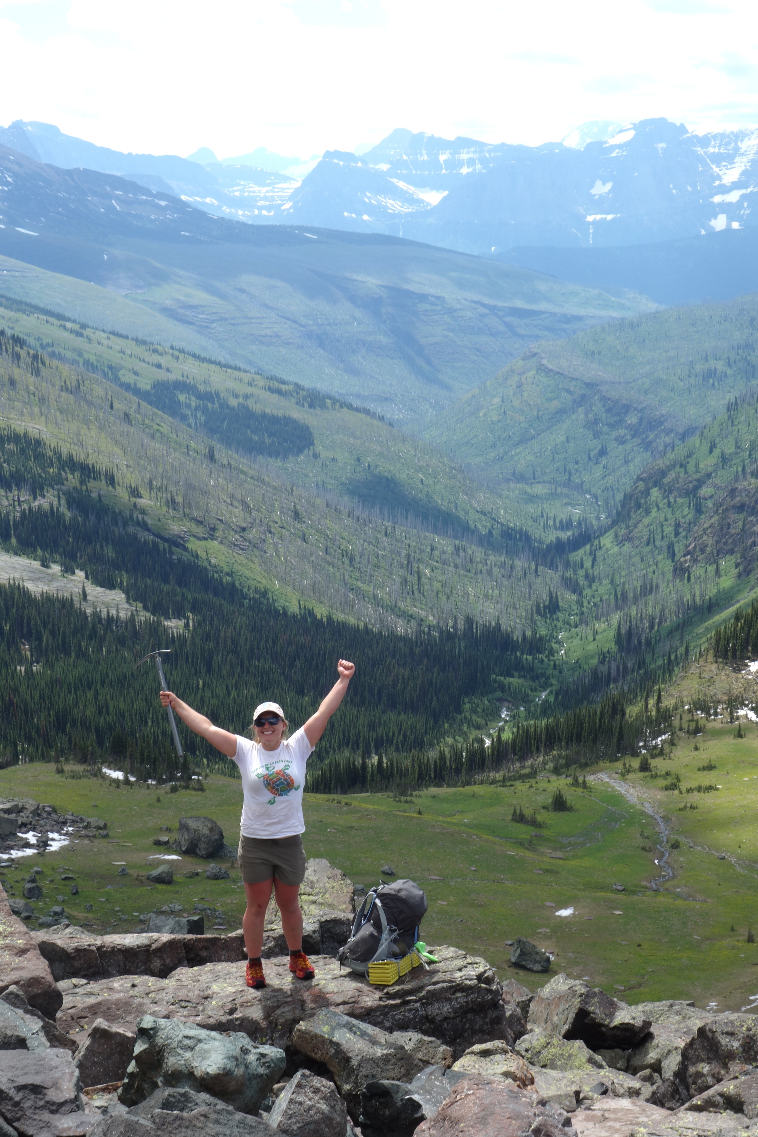Laugh Track the superhuman birthday hiker, stoked to be on solid ground, holds her new best friend to the sky in triumph.