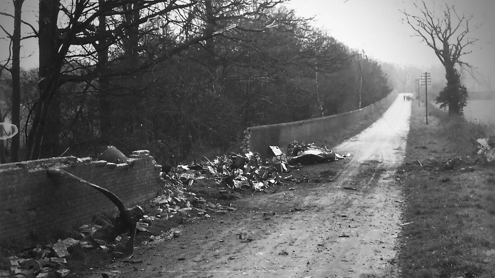 crash site of Hightower's B-17 (note the bent propeller resting against the wall at left)