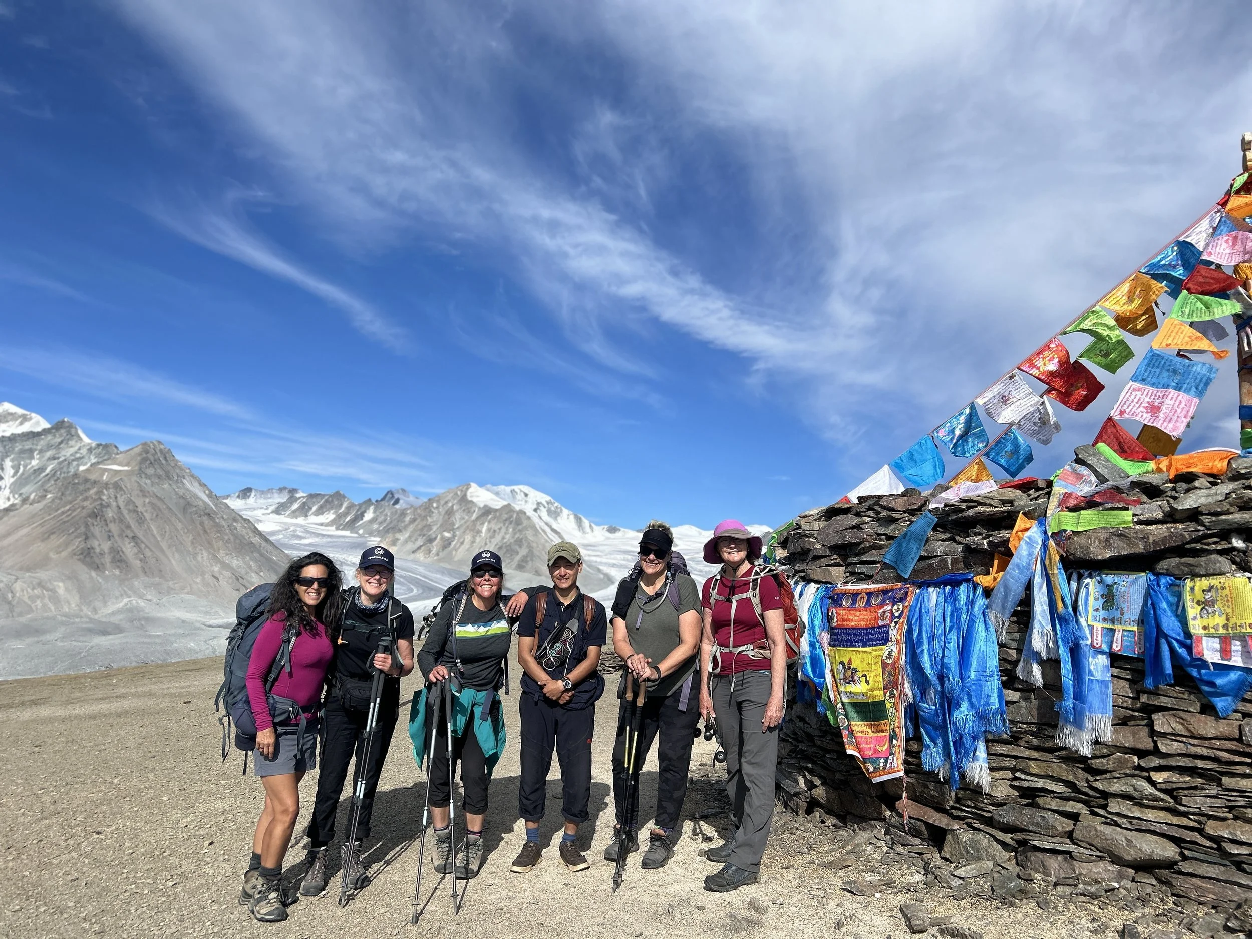 Adventurous women posing at Tavan Bogd mountain shrine