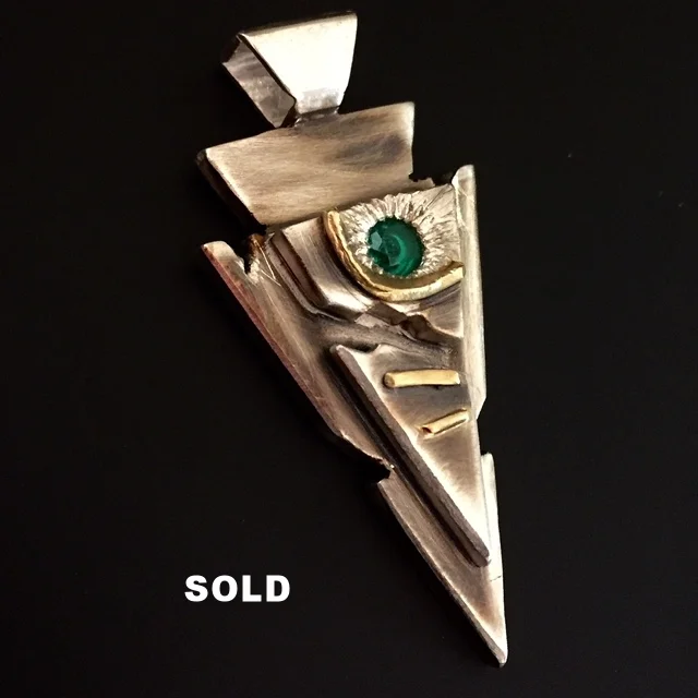 Silver Arrow Pendant Accented with Gold and an Emerald