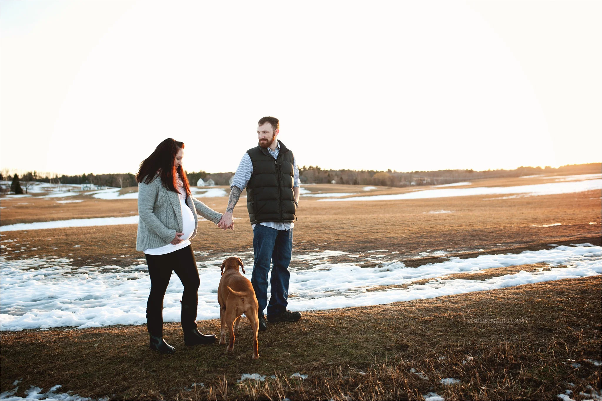 man and women walking their dog