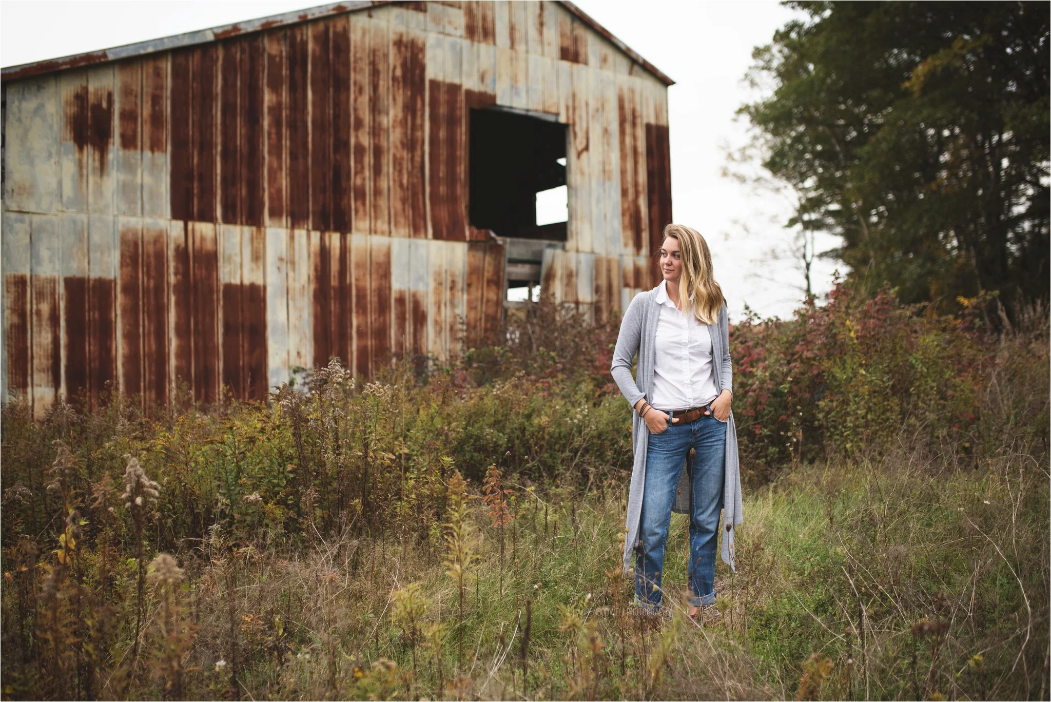 women standing next to a building