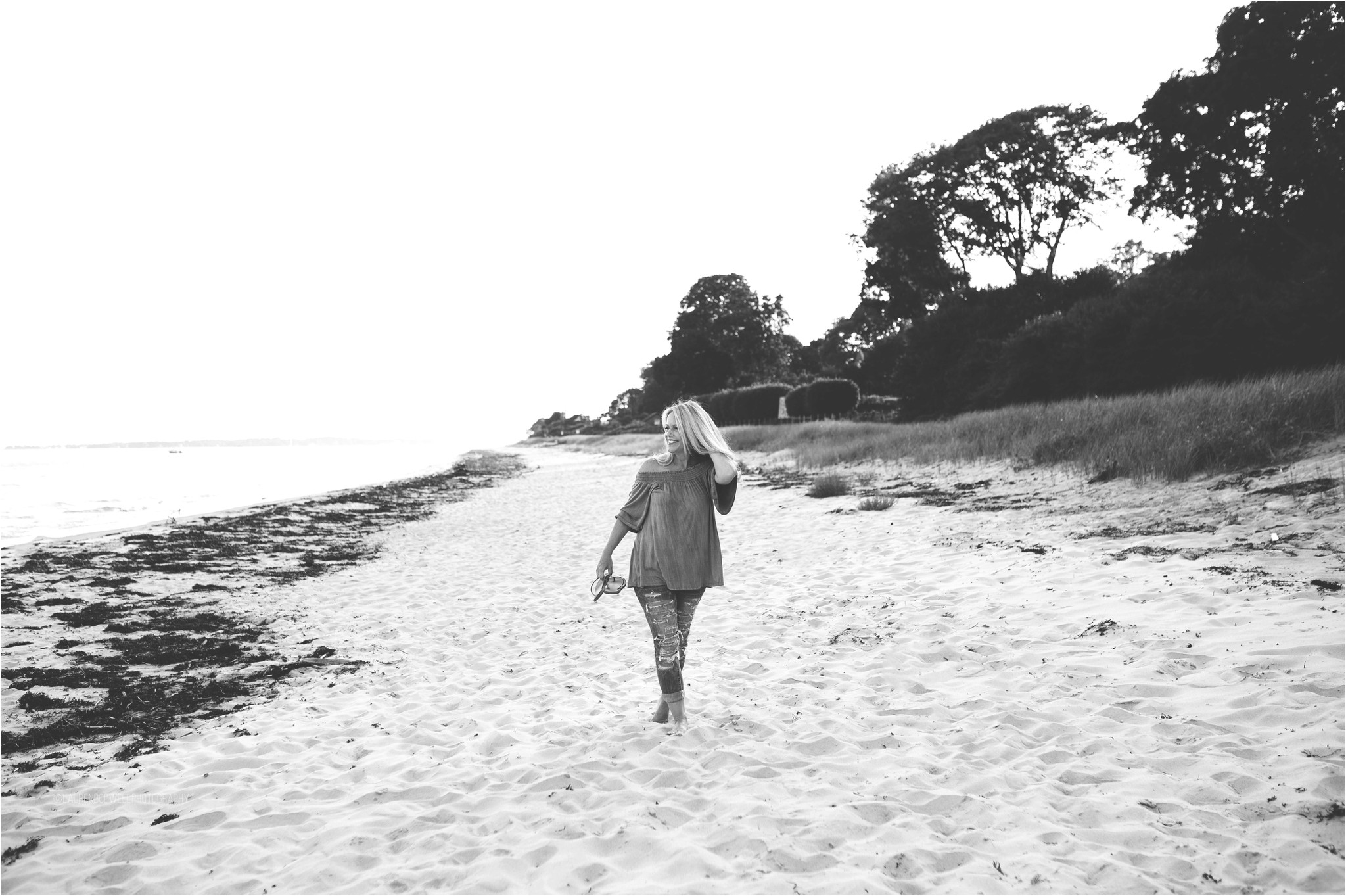 women walking along the beach