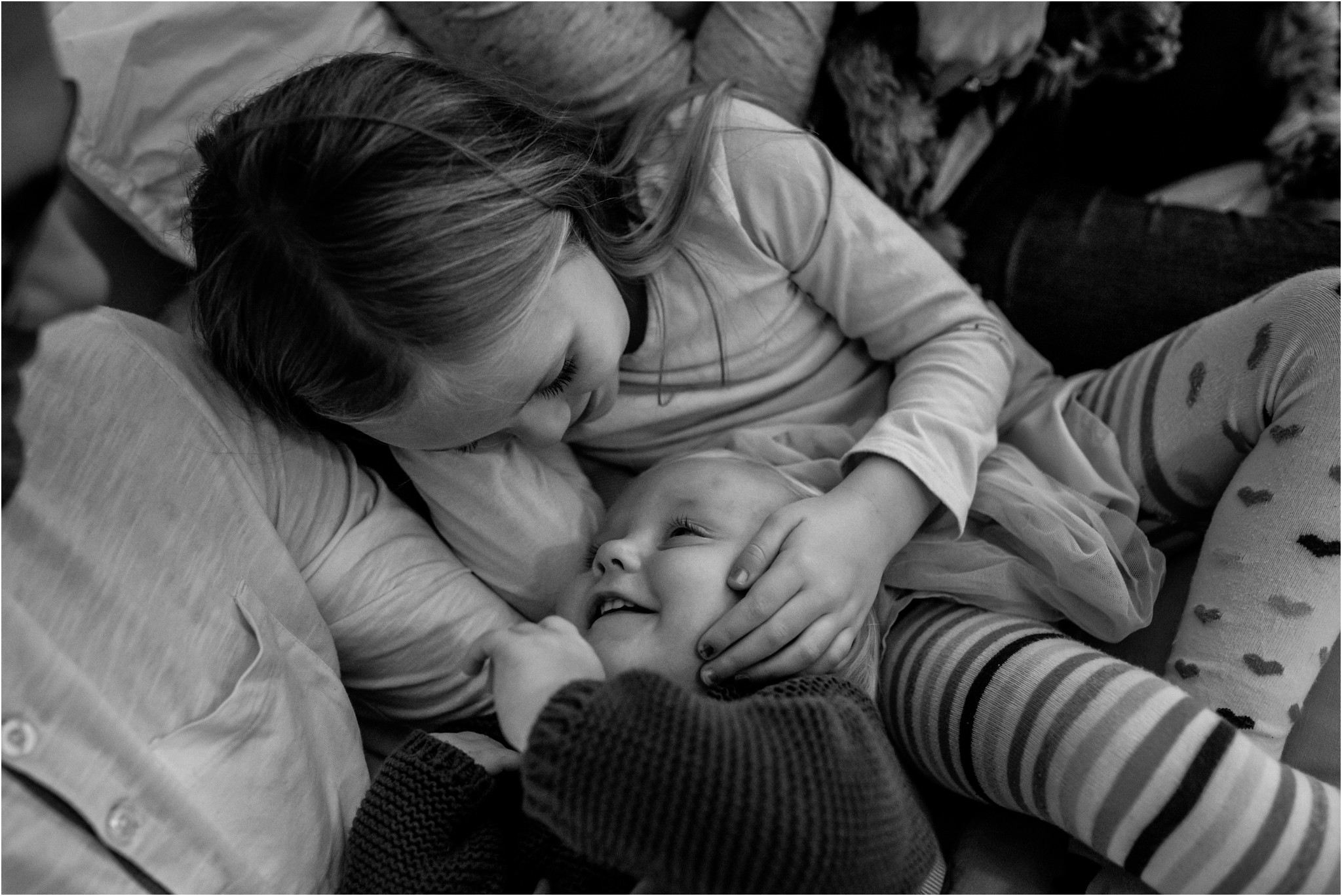 Sister touching her brother's face